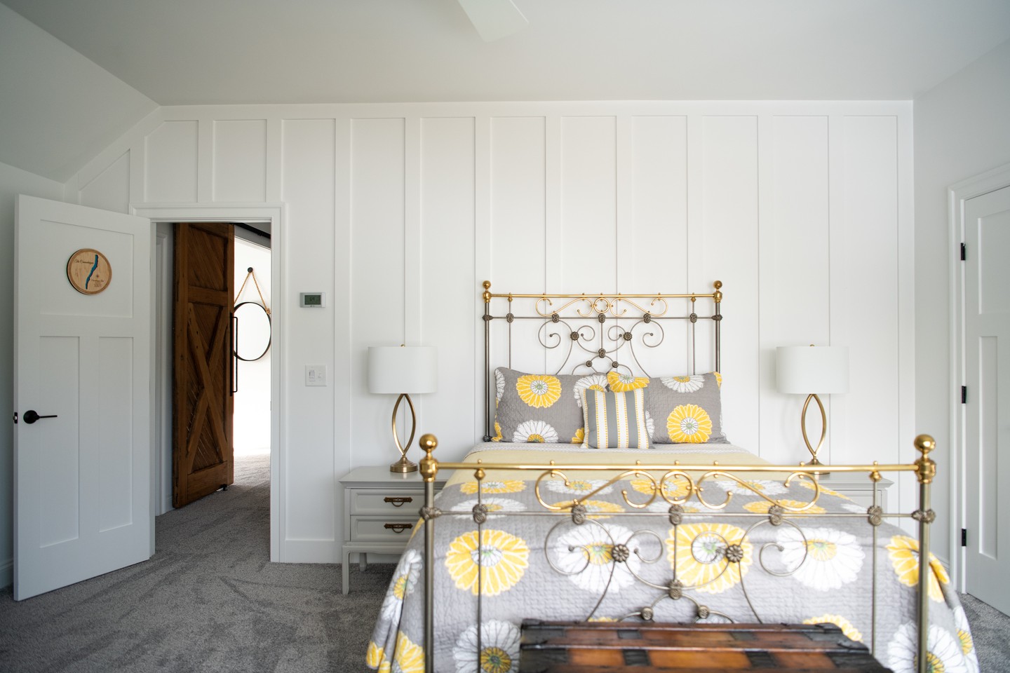 Soft light, textured walls, cozy bedding. This bedroom blends farmhouse charm with modern ease. Custom crafted for restful nights.
