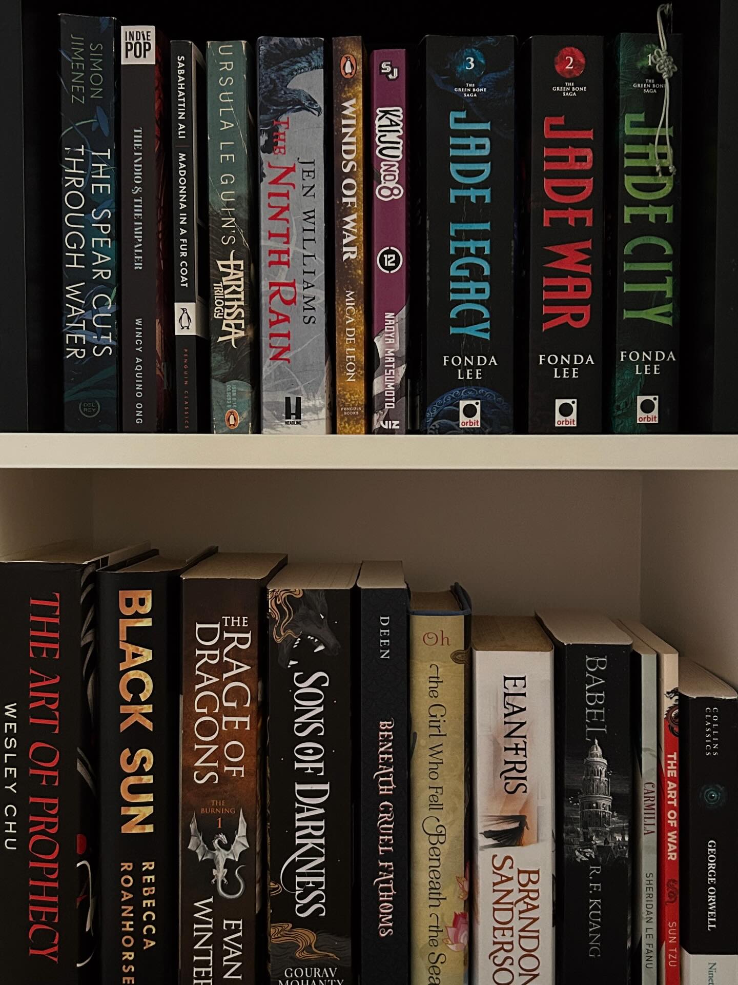 my physical tbr shelves 🤍
(green bone saga and eye of the world is read, they’re just there bc i like rereading certain passages every now and then)
one of the ways i keep my peace of mind is separating my unread and read books — there was a time they were all together and it was an event every time i was looking for a new book. it always felt like i had nothing to read 🗿
i’ve also been in a fantasy flow state recently, especially after reading royal assassin even though i’ve settled on how farseer isn’t for me and how much i dislike Molly’s character. it was oddly motivating and had me exploring old fantasy and backlist titles.
the quote at the end is from one of my current reads (The Book of Fallen Leaves by A.S. Tamaki) i’m reading an ARC so it’s not fully official but i felt like sharing