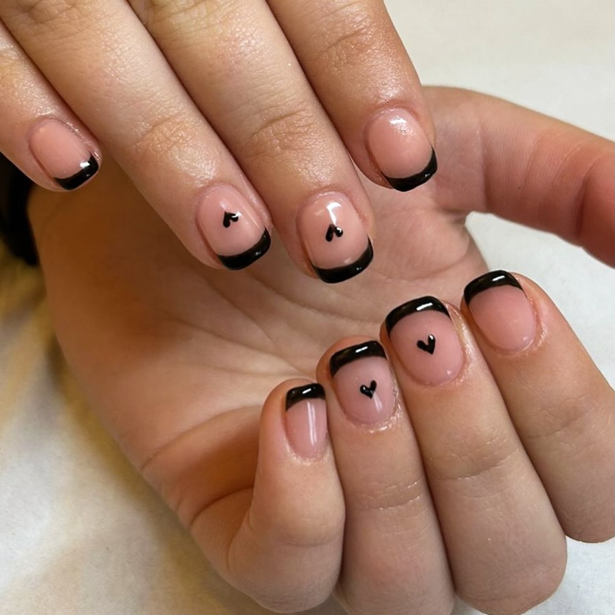 Valentine’s Day, but make it Wednesday Addams.
Dark tips, delicate hearts, and unapologetic edge 🖤