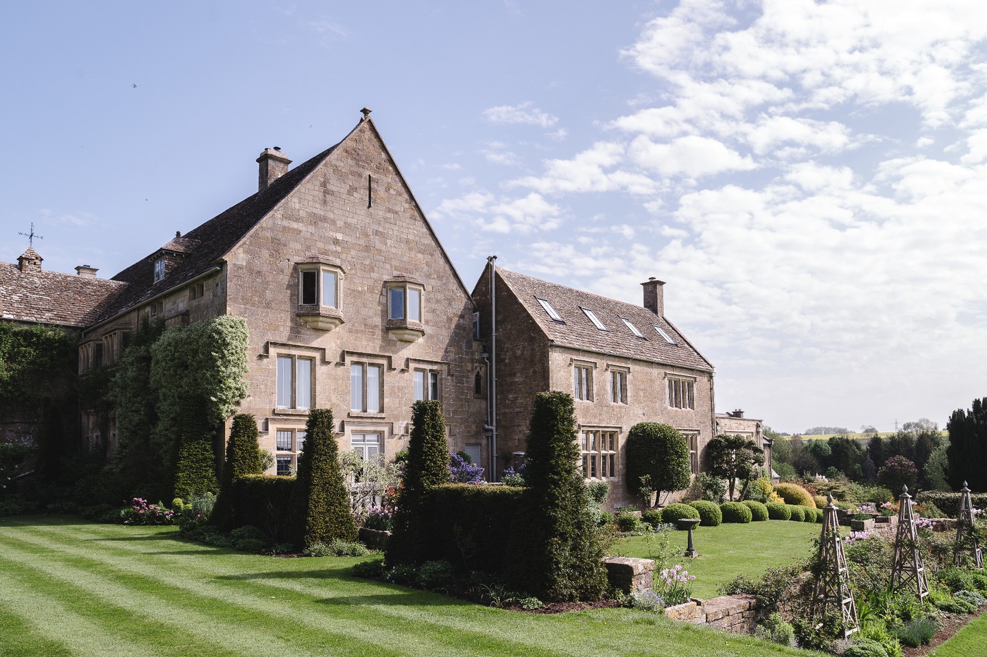 Coombe End Manor in spring , gleaming in the sunshine.