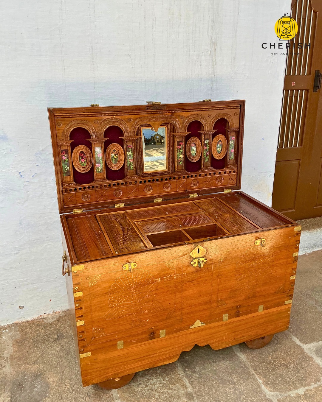 *SOLD*
✨ A Trousseau Chest, Meant to Travel
Colloquially known as a Rangampetti 💛— a name drawn from Rangoon Petti — this chest points to a journey that began across the Bay of Bengal.
Likely crafted in Burma (present-day Myanmar), in Rangoon, by highly skilled carpenters working in teak, these chests made their way to India through trade and migration. They were prized for their material, workmanship, and thoughtful construction — and often became trousseau chests, accompanying brides into new homes.
Brass-edged and engraved with peacocks and floral motifs, the exterior carries a quiet sense of celebration. Inside, it opens to a mirrored panel framed by carved arches, velvet-lined niches, and layered compartments — spaces meant for jewellery, silver, letters, and things that mattered enough to travel.
Set on wooden wheels, it was built to move. And to last!
Dimensions: 39.5 × 19.5 × 28.5 inches
Please DM for details.
.
.
.
.
.
#CherishVintageFinds #ValentinesWeek #bridaltrousseau #burmateak #BrassDetails