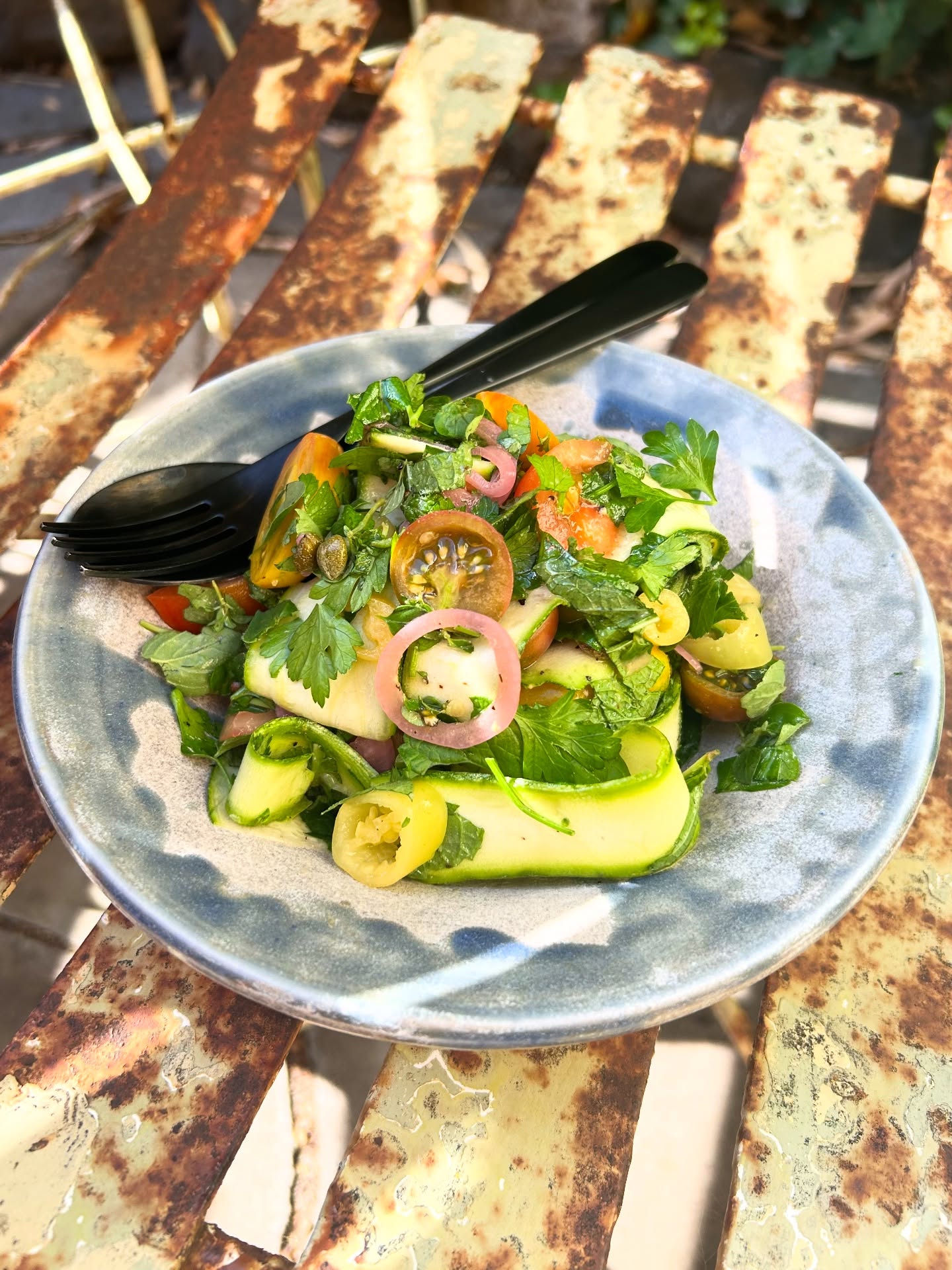 Very good little summer salad I made the other night. The produce definitely made it extra special with heirloom zucchini that was in my @ceresfairfood veggie box & mixed coloured heirloom cherry tomatoes that I bought from the @collingwoodchildrensfarm farm gate stall.
Here is a rough recipe.
Serves 2-3 as a side
2-3 handfuls of cherry tomatoes cut in half
1 zucchini ribboned with a vegetable peeler
3 fefferoni pickles sliced
2 Tbsp of pickled red onion
1 tablespoon of capers
2 large handfuls of fresh herbs. I used thyme, oregano, mint & parsley. Roughly chopped.
Dressing
Lemon juice
Flakey salt
Maple syrup
Pepper
Olive oil
Dijon mustard
Splash of the pickled onion juice
Mix all together serve immediately