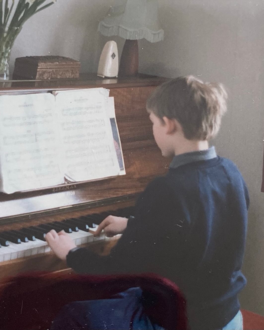 I think I started piano at 4, maybe 5. I’m still rubbish at it- I had to do tonnes of practice and it was all classical. It didn’t suit me. But keys in music did. It’s a good place for me. I wish I’d known how to play an amin7dim before I’d learnt to spell scherzando. It’s never too late. Get learning music.