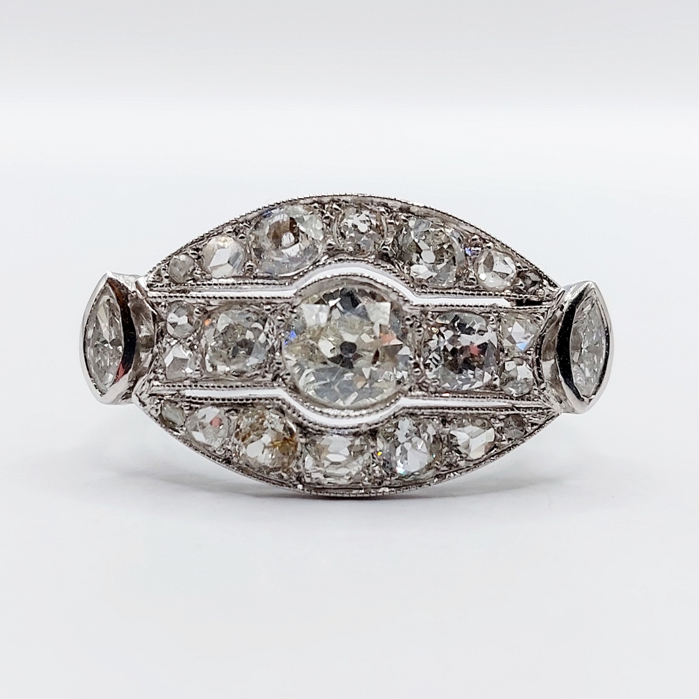 French art Deco inverted marquise ring 18k white gold set with 2.25 carats of old mine cut diamonds, rose cuts diamonds and marquise cut diamonds in a finely crafted setting
PRICE : 3300€
Magnificent craftsmanship
Size: 54.5 FR / 7 US
Weight: 6.42 g
Main diamond size: approximately 6.0/6.2 mm (estimated at 0.80 carats)
Secondary diamonds (x2): approximately 4 mm (estimated at 0.50 carats total)
Tertiary diamonds (x4): approximately 3.4 mm (estimated at 0.60 carats total)
Small diamonds (x14): from 2.5 to 1 mm (estimated at 0.20 carats total)
Marquise cut diamonds (x2): 5 x 2.5 mm (estimated at 0.15 carats total)
Diamonds in good condition, small inclusions visible under magnification
Size Head: 14.2 x 25.3 mm
Microscratches from use
Weevil hallmark almost completely worn away and goldsmith's mark (French hallmark)
#frenchjewelry #diamond #diamondring #antiquering #victorian #victorianring #marquisering #augustusjewels #vintagering #daisyring #daimondhaloring #toietmoi #toietmoiring #baguetoietmoi #oldminecut #frenchjewelry #oldminecutdiamond #rosecut #rosecutdiamond #omcdiamond #oldminecut #oldminecutdiamond