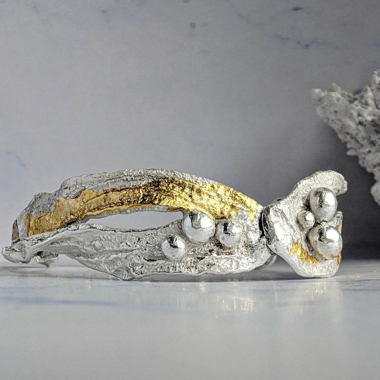 Capturing this bangle in a way that photography did justice was absolutely impossible! This is the seaweed bracelet and each piece of solid silver has been hand cut, textured and then slowly formed into shape. This is a long and careful process as too much manipulation can make the silver brittle, so you have to take your time and soften and clean the silver throughout the process. Then there are the beautiful 24ct gold accents. For this reason there is ONLY ONE and it's going to be at the @inspiredby.gallery in Danby, along with a few other one off creations.
#handmadejewellery #oceaninspiredjewelry #artisanjewellery #lovearts #oneofakindjewellery