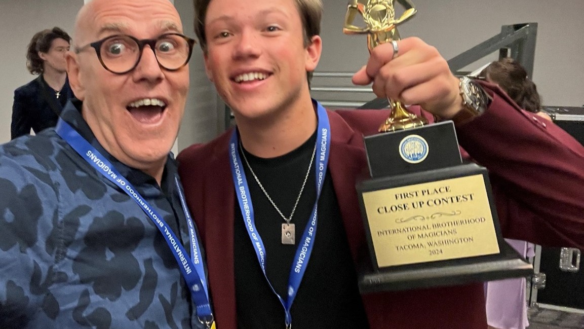 When a magician steps onto the stage at an International Brotherhood of Magicians competition, they’re not just performing a trick…
They’re stepping into the major leagues of magic.
Getting a trophy from the I.B.M. is one of the most prestigious awards in magic (that's why so many past winners are quick to use their win in their bio and taglines.)
Here is Keith Fields (IBM Contest co-chair) celebrating with Geno Ploeger (2024 IBM Close-up Championship) after his win. It is now time to start thinking about what you will do in the next competition. The I.B.M. is accepting submissions for 2026 so find out more at magician.org/contest
