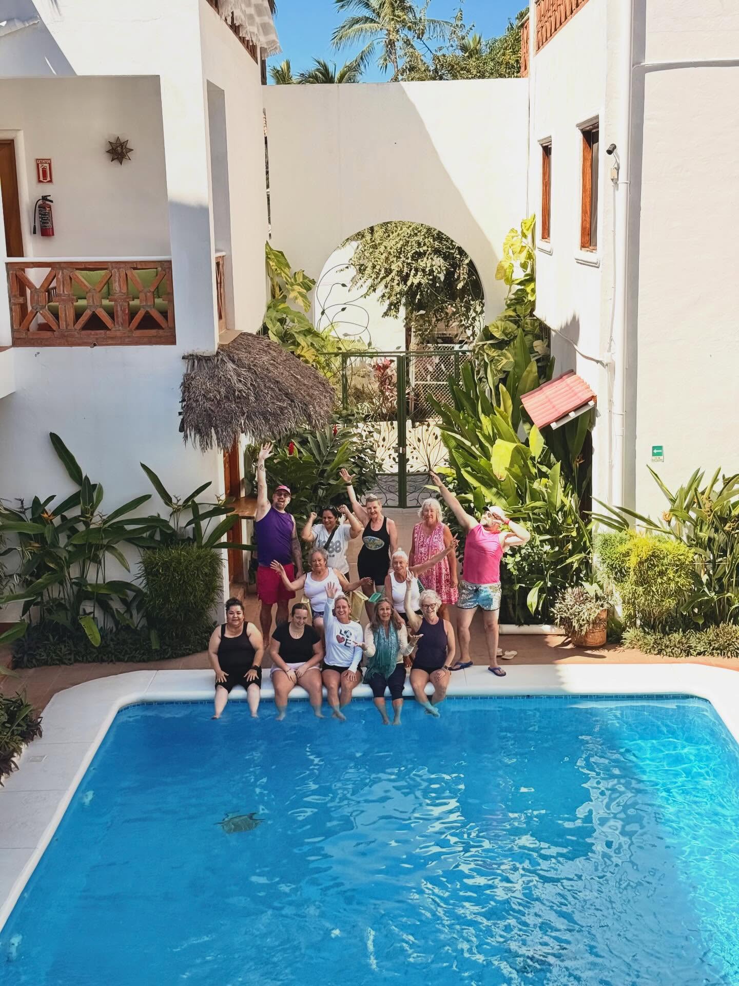 A little courtyard.
A blue pool.
White walls holding sunlight. 🌞💦
And a group of humans who chose growth over comfort.
This space became our home for the week — mornings starting slowly with coffee and reflection, afternoons cooling off in the water, spontaneous conversations happening on balconies and by the plants.
What I love about this setting is how intimate it feels.
You walk out of your room and you’re immediately part of the experience. No hiding. No rushing. Just presence.
The architecture wraps around the courtyard like an embrace.
The tropical greenery softens everything.
The pool becomes the heart of connection.
Between sessions, this is where integration happened.
Laughing. Sharing. Letting insights settle.
Retreats are not just about yoga and meditation.
They’re about creating an environment where transformation feels natural.
And sometimes, all it takes is sun, water, and the right people. 🌿✨
If you’ve been craving a reset, a deeper connection, or simply a beautiful container to breathe again… maybe this is your sign.
#WellnessTravel #Mindfitness #RetreatLife #Sayulita #YogaRetreat HealingSpaces TravelWithPurpose TransformationJourney ConsciousLiving WellnessRetreat CommunityHealing FromBurnoutToBliss