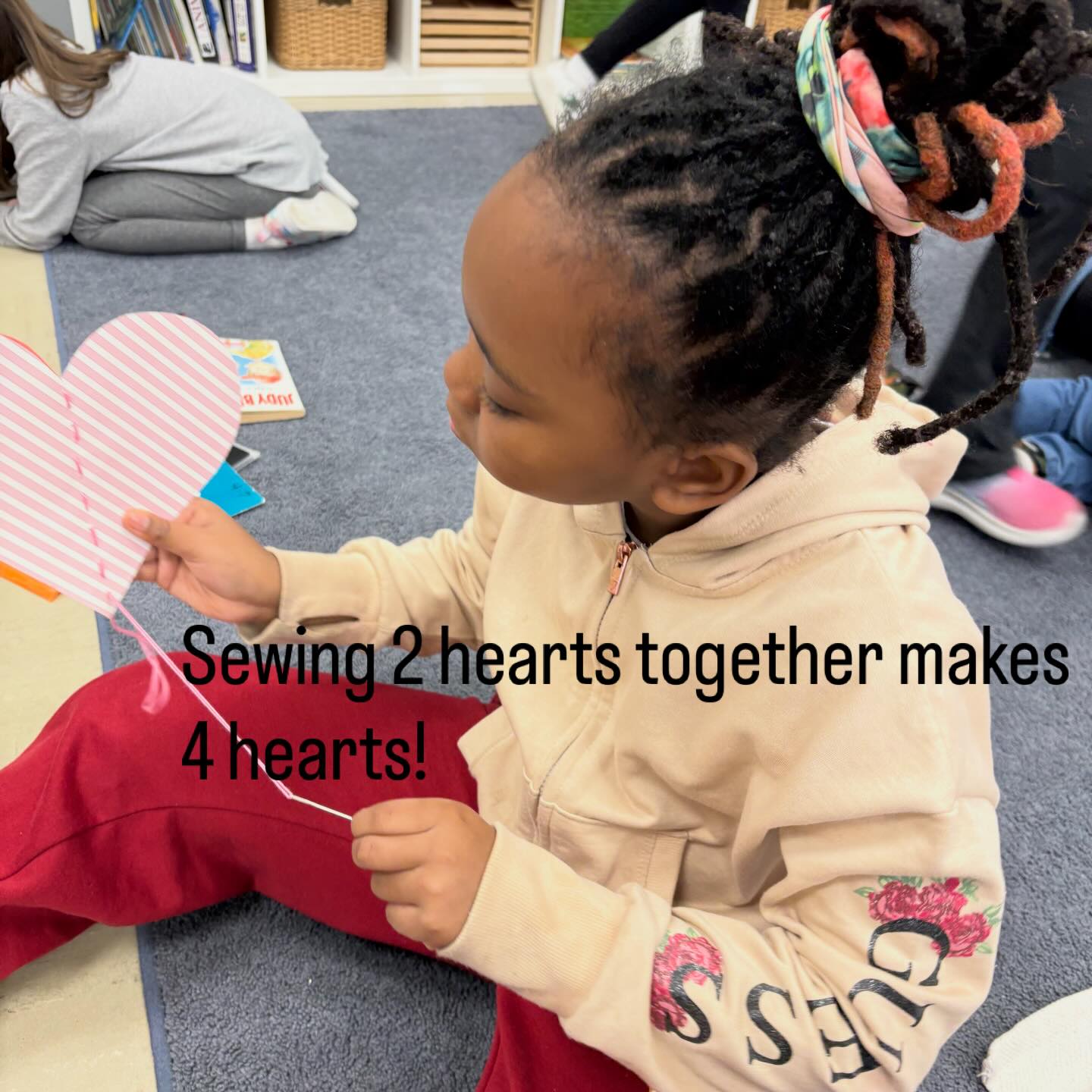 Creating a hanging heart mobile for Valentines Day! 1. Cut out two hearts. 2. Fold hearts in half. 3. Sew down the fold with a long thread starting at the top. 4. At the bottom of the heart, on the bottom of the string, add a bead or a felted ball for weight. 5. Open up the sides to see four hearts and hang.