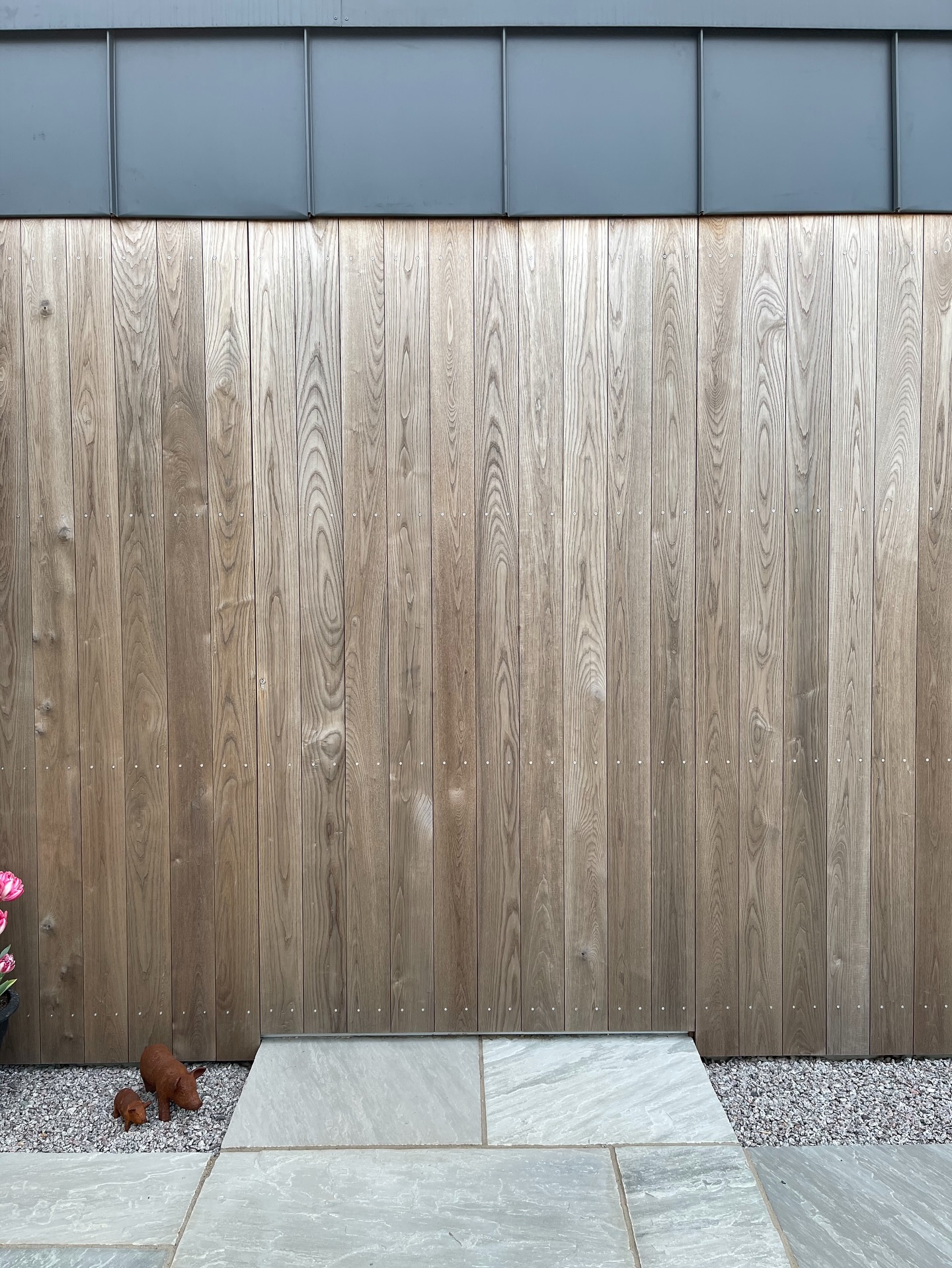 No frame. No statement. Just a seamless plane that reveals itself only when you need it to.
Designed to sit completely flush with the facade, this front door is clad in the same timber as the surrounding elevation, so when itโs closed, it quietly dissolves into the building.
โข
Build by JRBucketts and Sons