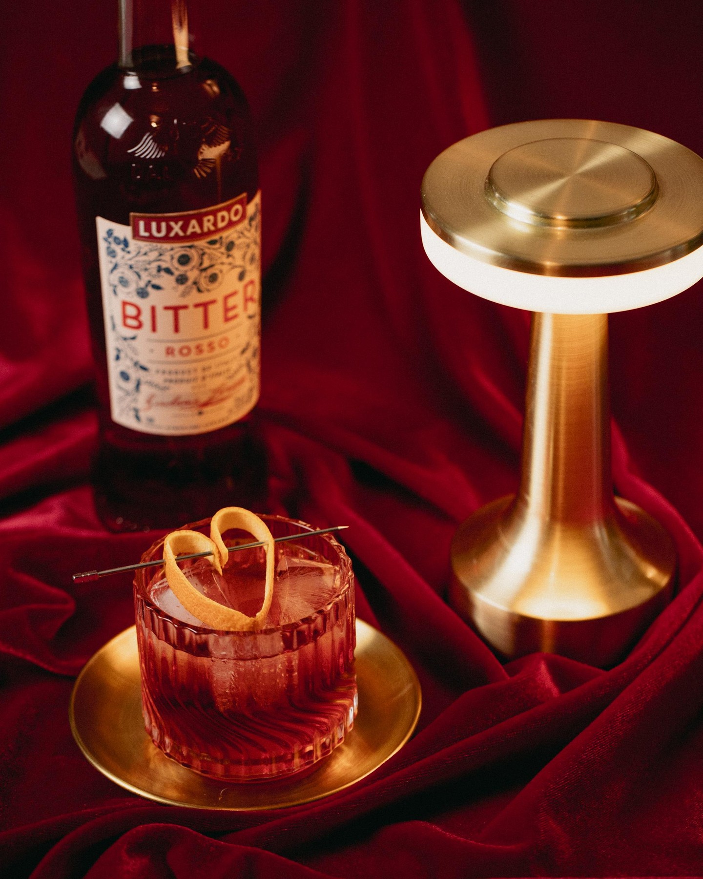 A classic Negroni with a little love. Made with Luxardo Bitter Rosso and garnished with a heart-shaped orange peel โ bittersweet never looked so good.