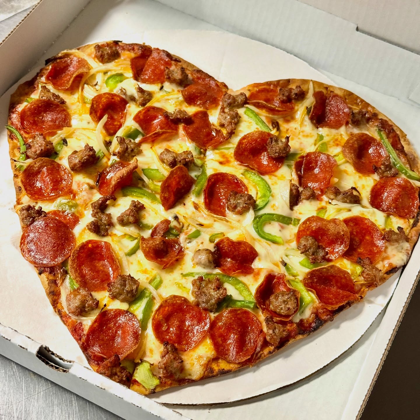 Heart-shaped pizza all week long ❤️ 🍕 #jpspizzaandgrill #jpspizza #pizza #wilmette #valentinesday