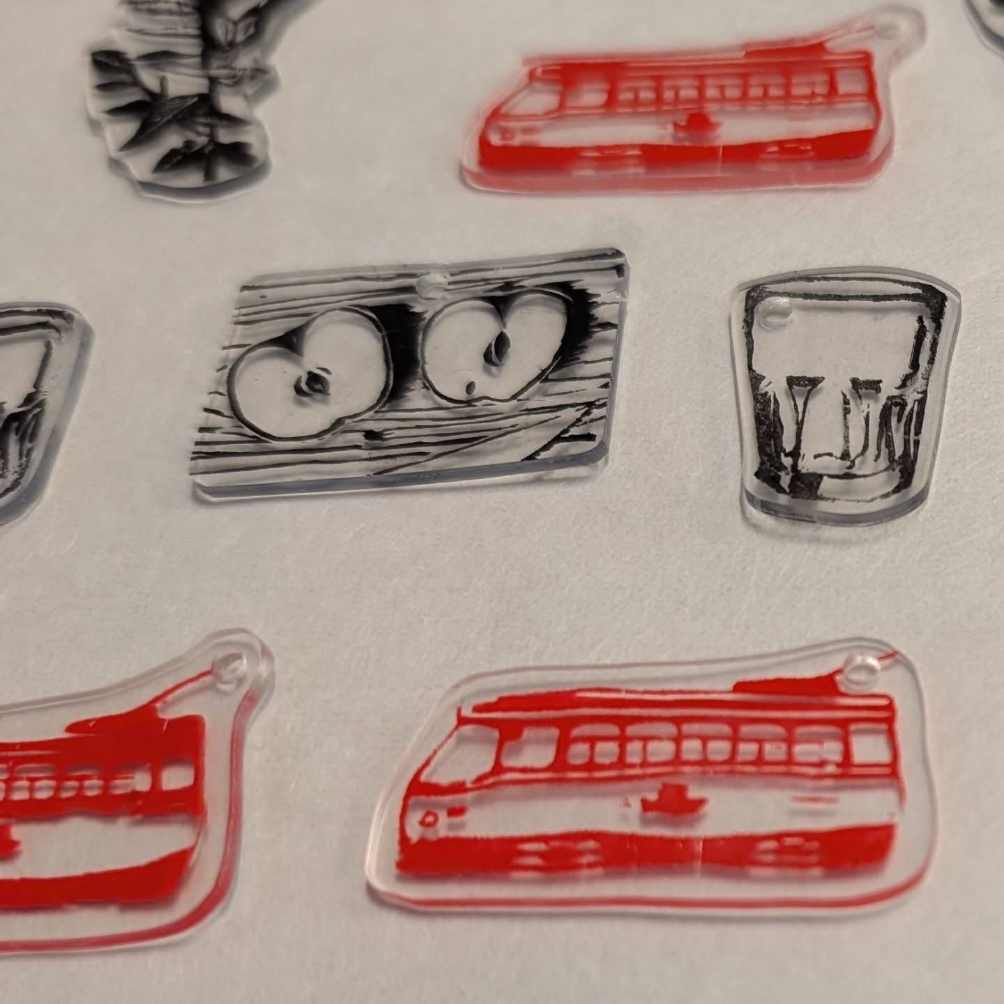 Happy Family Day!
This is your last chance to register for our upcoming TAG TEAM family-friendly workshop, where you get to work alongside guardian/child to create some fanastic art and fun memories! See info below:
TAG TEAM: Charm Bracelets Workshop
Saturday February 22, 2026
10am-12pm
$75 (one adult + one child)
With Amye St John
Register at link in bio or www.inprintcollective.com/join-a-workshop.
TAG TEAM is a series of one-day family-friendly workshops at inPrint, where you create a work of art side by side with your loved ones! Workshop registration is done in pairs for an adult + child (max two total participants per registration).
Get your bestie and have some fun making charm bracelets together the inPrint way!
Using permanent markers and an array of stamps from inPrint's collection, create charms you will add to a bracelet of your own making! We'll print onto shrink film and bake, and then curate our charms onto a piece of jewelry. Each pairing can make two bracelets - perfect for swapping or gift giving or making matching sets!
All materials are included with class fee. Recommended for ages 6 and up. Adults must accompany children. One registration = 1 adult + 1 child.
ID: an aerial view of a series of shrink film charms made from various stamps including a streetcar, a flower, a glass, and apple slices.