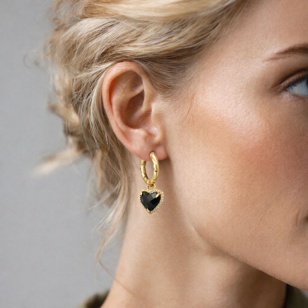 We are obsessed with the gorgeous Sophia Earrings! The perfect combination of femininity and edginess, the Sophia Earrings bring out your inner femme fatal, making them the perfect accessory for date night or a special occasion. Crafted from 14K gold plated metal, these earrings are both beautiful and dainty, adding a delicate touch to any outfit.