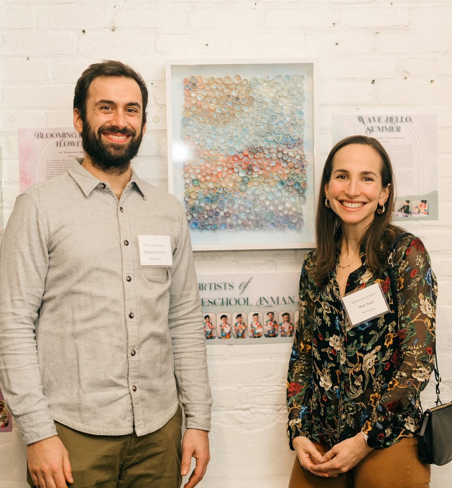 Congratulations to the Siegel Family ❤️ #POTAArtAuction
Preschool Inman Square: Wave Hello, Summer
This artwork was created by Inman Square preschoolers using paint spray bottles and rolled paper. First, the friends painted the background with light blue paint to represent the sky and ocean, using free-flowing brushstrokes to show the movement of the water. Next, they prepared colorful papers by spraying watercolor paint onto recycled paper and, with the help of a Morah, slicing them into strips once they were dry. They then rolled the colorful strips into small circles and glued them onto the canvas to create the shapes of waves, the sun, sky, and clouds. The categorized colored papers, placed close together, add texture and bring the picture to life.
This process supported the development of fine motor skills, creativity, and teamwork while exploring nature-themed art through recycled materials. Like waves in the summer ocean, our preschool class is always moving forward. This artwork reflects how far our preschoolers have come through creativity and play, while also reminding us of the beautiful gift of watching and collaborating with them as they continue to grow, one wave at a time.