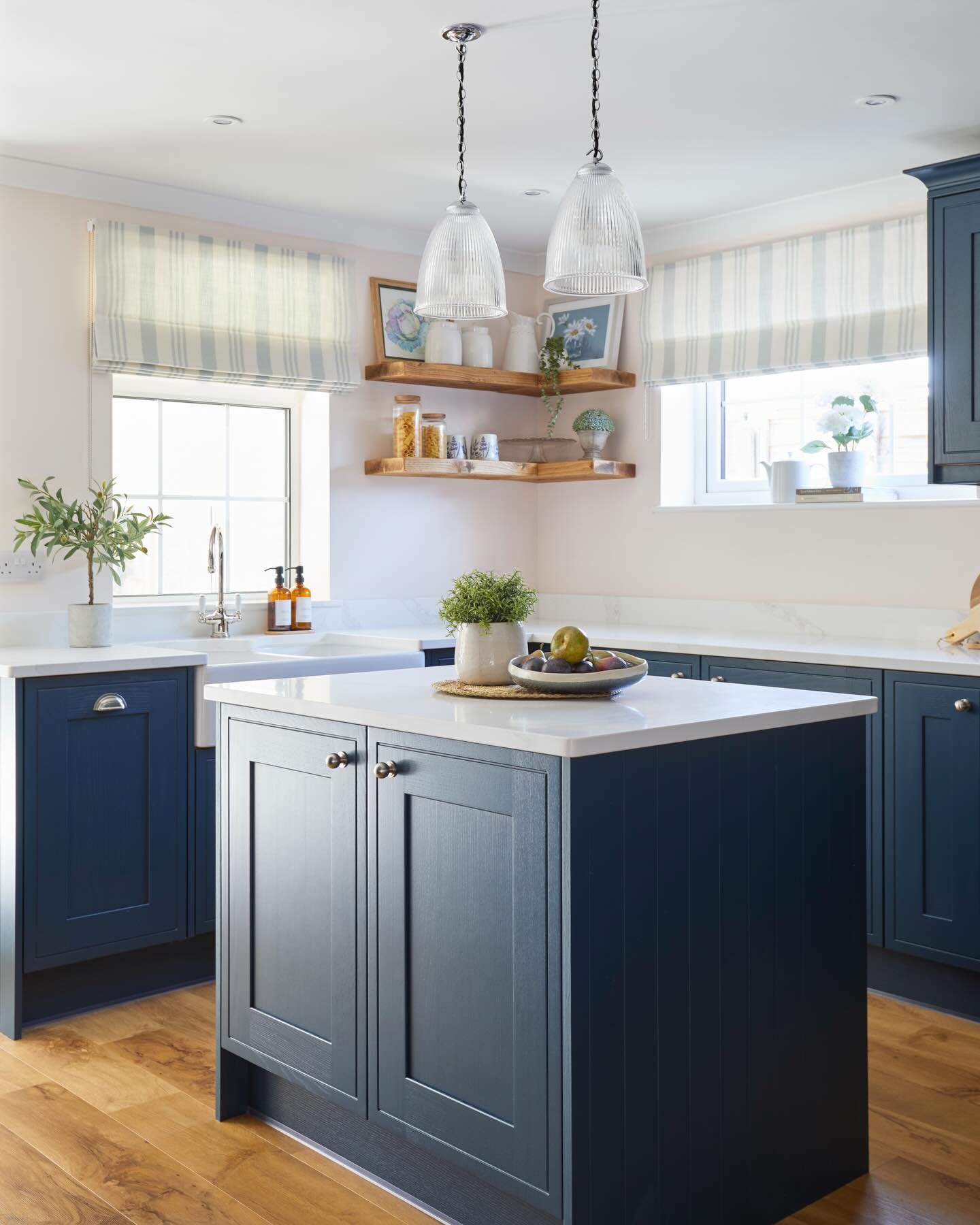 ~ Kitchen Makeover ~
~ Swipe for BEFORE ➡️
~ This kitchen is a perfect example of why colour confidence matters.
~ The original space had cream cabinets, black flooring and black worktops and despite being neutral, it felt heavy and completely at odds with my clients’ personality when they moved in.
~ They loved navy and were drawn to the idea of using it on the cabinetry, but understandably felt nervous. After living with a dark-feeling kitchen already, they worried navy would make things worse.
~ The key was balance. We paired the navy cabinets with warm oak flooring, white marble worktops and Farrow & Ball Tailor Tack Pink on the walls to soften the space.
~ Add oak shelves, textured Roman blinds, greenery and homely details and suddenly the room feels calm, welcoming and completely theirs.
~ Proof that dark colours aren’t the enemy. It’s all about what you pair them with.
#kitchenbeforeandafter #kitchentransformation #interiordesignuk #interiordesigner #timelessinteriors
kitchen makeover | before and after kitchen | navy kitchen cabinets | Farrow and Ball Tailor Tack Pink | warm oak flooring | marble worktops | layered interiors | calm kitchen design | colour confidence | interior designer uk | real family homes | timeless kitchen style | homely interiors | kitchen styling ideas | Amy Elizabeth Interiors