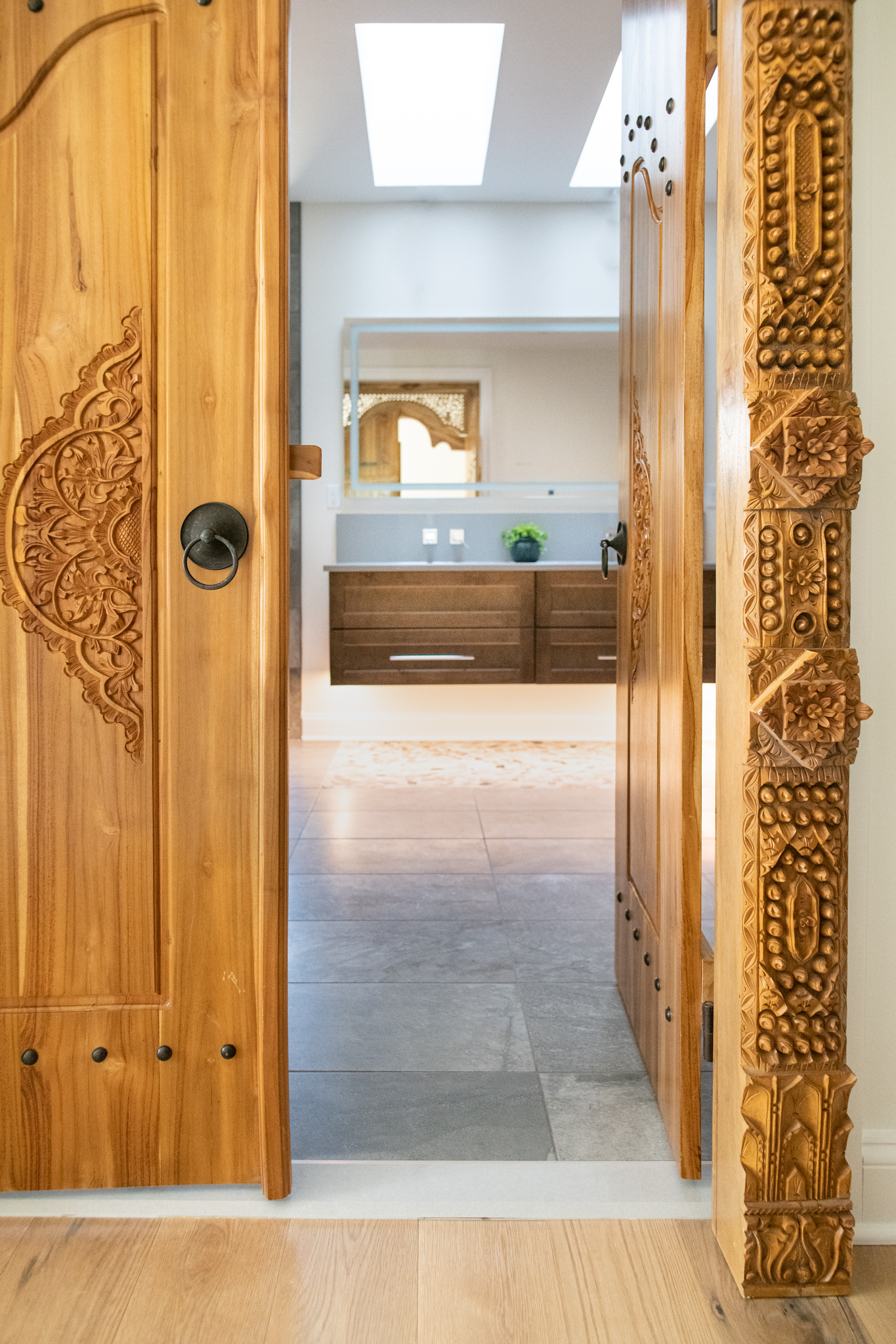 Intricate woodwork meets clean modern bath. Your home, uniquely yours.