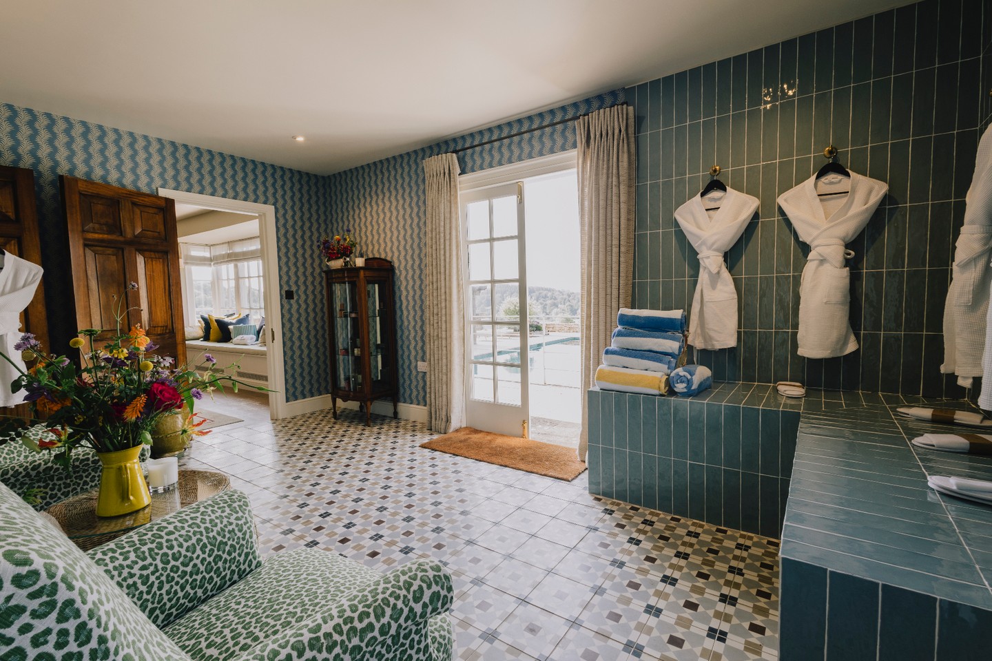 Tucked away at the garden's edge lies our private sanctuary - the spa. Beyond the threshold, you'll discover a curated wellness suite, featuring a sitting room, two treatment rooms, changing room, and a nail salon - all designed for complete restoration.