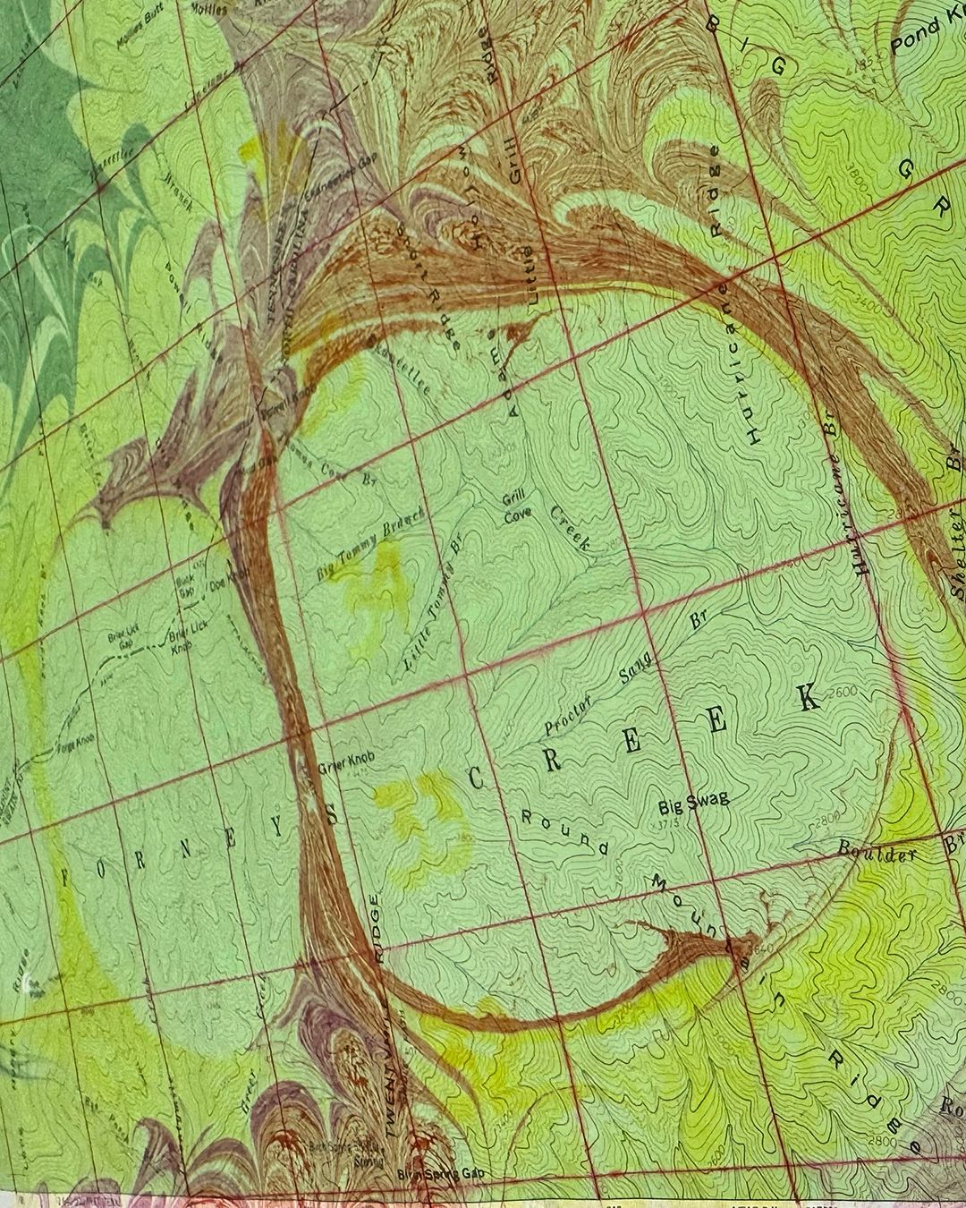 “CADES COVE” (detail) marbling on vintage topo map
Cades Cove is a family favorite among many living here in Western North Carolina and Tennessee. With hiking trails, waterfalls, wildlife, and beautiful vistas, who could resist. An 11 mile driving loop makes this 6800 acre valley easily accessible in the Great Smoky Mountains with numerous stops for historic churches, historic cabins owned by the first settlers to the region, and the John. P. Cable Grist Mill.
Each of the 19th Century buildings have a unique story to tell, however, I found one to be the most fascinating--a standing house with no nails. The John Oliver Cabin, the first structure on the loop and named after one of the first settlers, is held together by gravity. The notched wooden log corners don’t have nails or wood pegs securing them.