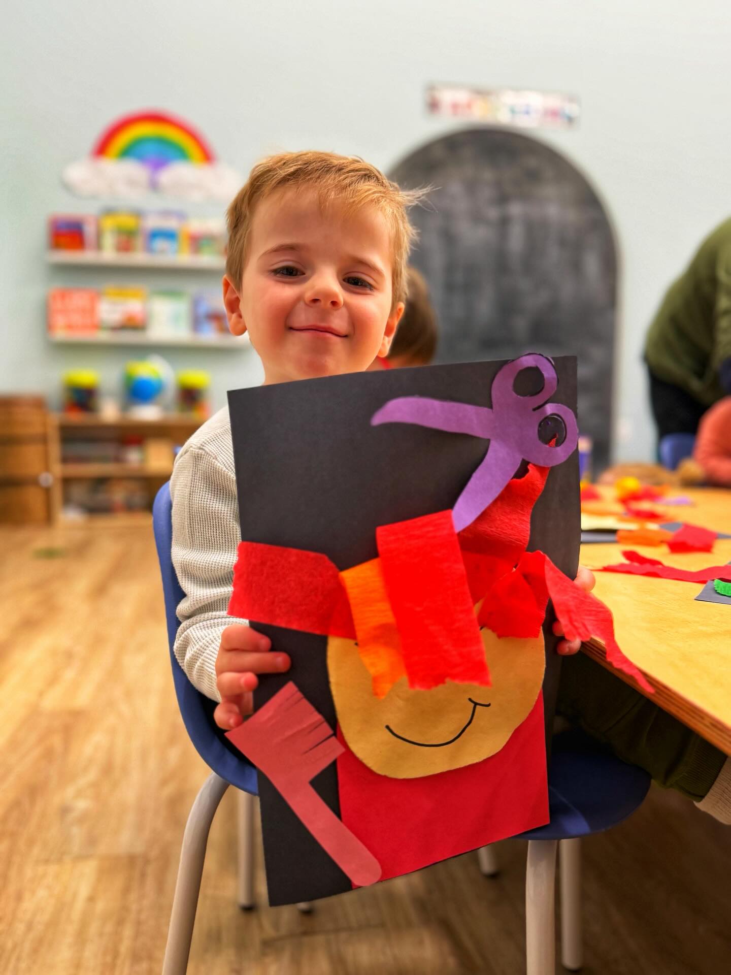 💇♀️✂️ El Peluquero (The Hairdresser )✂️💇♂️
Today was a hair-filled adventure in our classroom as we explored all about el peluquero and the important work hairdressers do in our community! We started our day with a silly and fun story about a lion who went to the salon and tried the funniest, wildest hairstyles. The kiddos couldn’t stop laughing and loved sharing which look was their favorite.🦁
After story time, our classroom turned into a busy salon! The children became little peluqueros, practicing their cutting skills by trimming “hair” and carefully styling balloon people. We talked about the tools real hairdressers use and focused on strengthening our scissor control and hand muscles.Our kiddos explored patterns with fun hands-on activities and everyone designed their own person and created unique hairstyles full of bright colors, zigzags, curls, spikes, and swirls so much creativity and imagination in one room!
we even helped Rapunzel with her crazy long hair by knocking down “rulos” (rollers) to find hidden bows with numbers inside. We practiced number recognition and matching while moving our bodies, working together, and cheering each other on. We even followed hair-inspired patterns on the floor moving in curly shapes, zigzags, and lines turning learning into full-body fun!
From Play-Doh hairstyles to cutting, painting, tracing, counting, and teamwork, today was full of laughter, creativity, and hands-on learning. What a beautiful way to learn about el peluquero and celebrate imagination in our little salon! 💛✂️