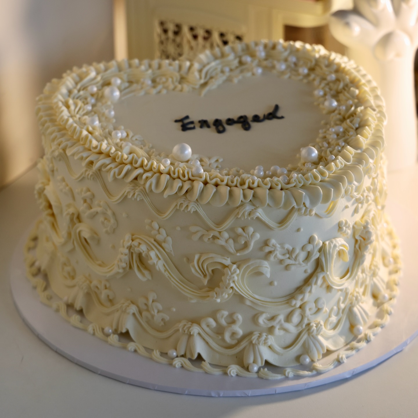 A 10 inch heart for the biggest “yes” 🤍💍
Crafted with ivory Lambeth details and pearls, made to be as delicious as it is beautiful 💫🫶
Nothing sweeter than hearing guests whisper: “Where is it from?” ✨🥰
.
.
.
.
.
.
.
.
.
.
.
.
.
.
.
.
.
.
.
.
.
.
.
#engagementcake #lambethcake #vintagecake #rocococake #cakesofinstagram