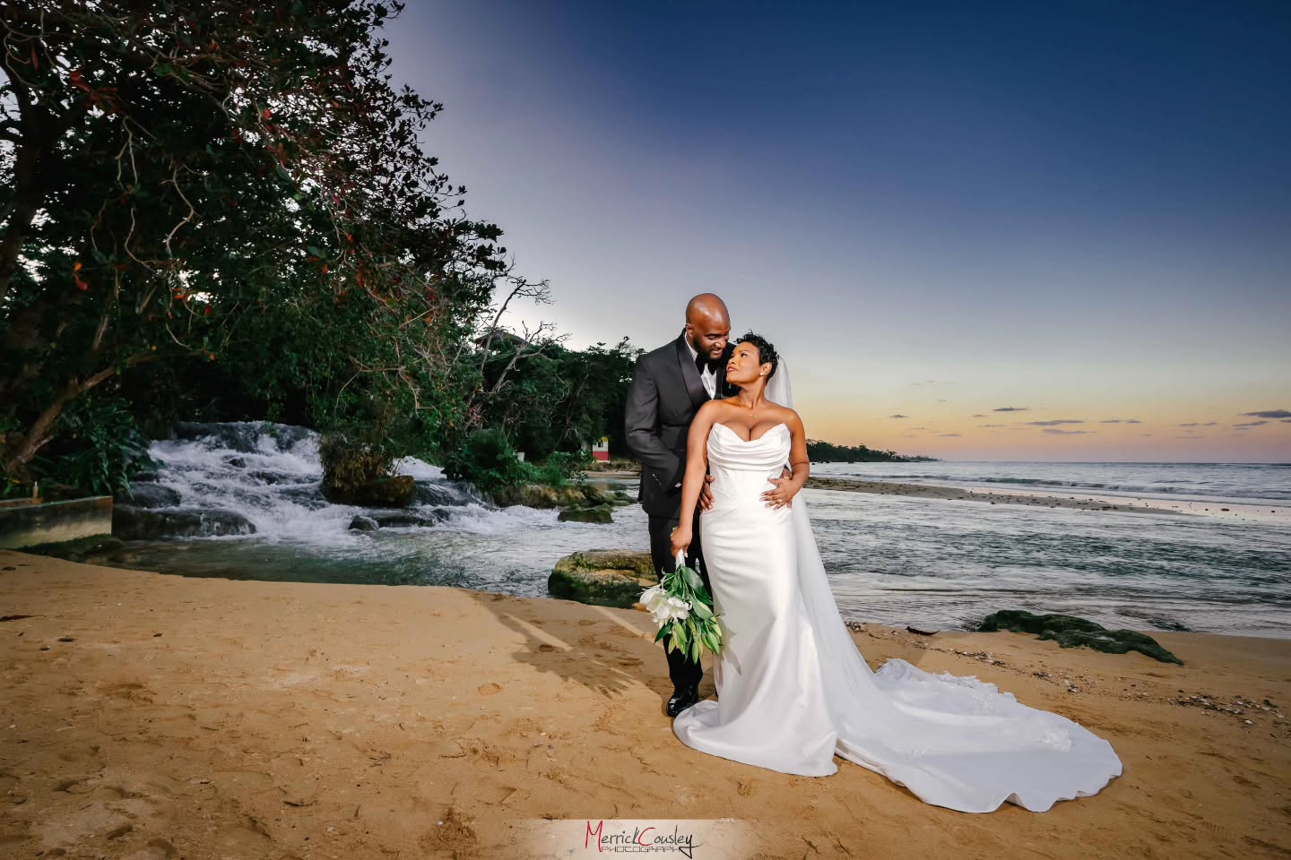 As the sun sets a gentle kiss is exchanged by the beautiful waterfalls at Laughing Waters, Jamaica.
Makeup: @dolce_beaute
Planning & Decor: @infiniteeventsplanningdecor
Flowers: @gorgeousflowersdraxhall
Cake: @kukupkreations
Catering: @alexdgreat.ja