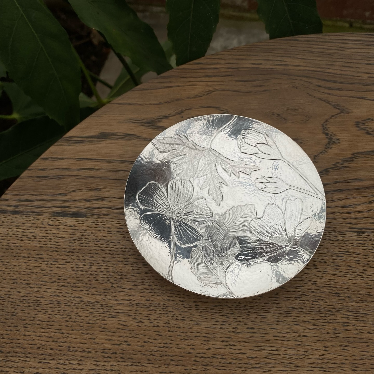 Chased shallow dish with interweaving wild flowers and leaves 🍃
I made this while @therepairshoptv were filming here. I began by sinking the form and planishing the surface, before building the floral decoration through chasing — using steel tools to embed texture and fine detail into the silver.
If you haven’t seen the episode yet, it’s on BBC iPlayer: The Repair Shop On The Road, Series 2: Falkirk ✨
Sharing some lovely images of the piece in the @hugoburgefoundation glasshouses, alongside a few screen grabs of it in progress during filming.
#silversmithing #therepairshopontheroad #handmade #chasingandrepoussé #silverdish @bbcscotland @bbciplayer