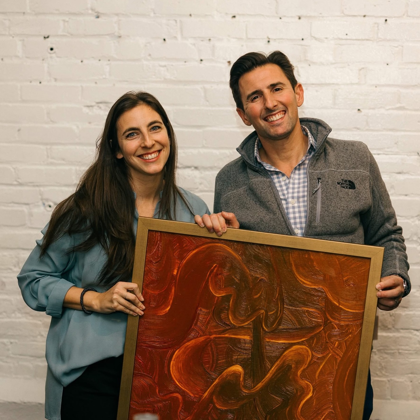 Congratulations to the Basch Family ❤️ #POTAArtAuction
Cambridgeport Pre-K: Leaves in the Wind
Our art auction piece this year is inspired by Kate Salinger’s swirling artwork and the falling leaves of autumn. We began by exploring Salinger’s art, noticing her curving and spiraling lines. The Morahs shared that Salinger is from Switzerland and often draws inspiration from the natural world around her. In connection with Tu B’Shvat, we then explored trees in Switzerland to spark our own ideas. While observing images of the trees, some Pre-K friends noticed that the curved lines in the bark and wood grain resembled the swirling patterns in Salinger’s work. This observation guided our planning for the piece.
To embody these swirling movements, the friends practiced creating curvy lines through scarf dancing, translating physical motion into visual expression. We then investigated repurposed art materials and different paint types, noticing how each created unique lines and textures. Our class chose oil paint because it best replicated the textures observed in the trees. Using pipettes and their hands, the friends mixed pigment and oil and experimented with finger painting on canvases, observing how the oil made the paint thinner and easier to spread. They also practiced swirling techniques on recycled cardboard using a variety of brushes.
For the final piece, we reused a wooden board from previous activities and prepared it with gesso. Friends added globs of brown oil paint and spread it using spatulas and brushes, then used cotton swabs and paintbrushes to create swirling patterns inspired by scarf dancing, tree textures, and Salinger’s artwork. Through this process, our Pre-K friends connected movement, nature, materials, and visual inspiration to create expressive, textured art.