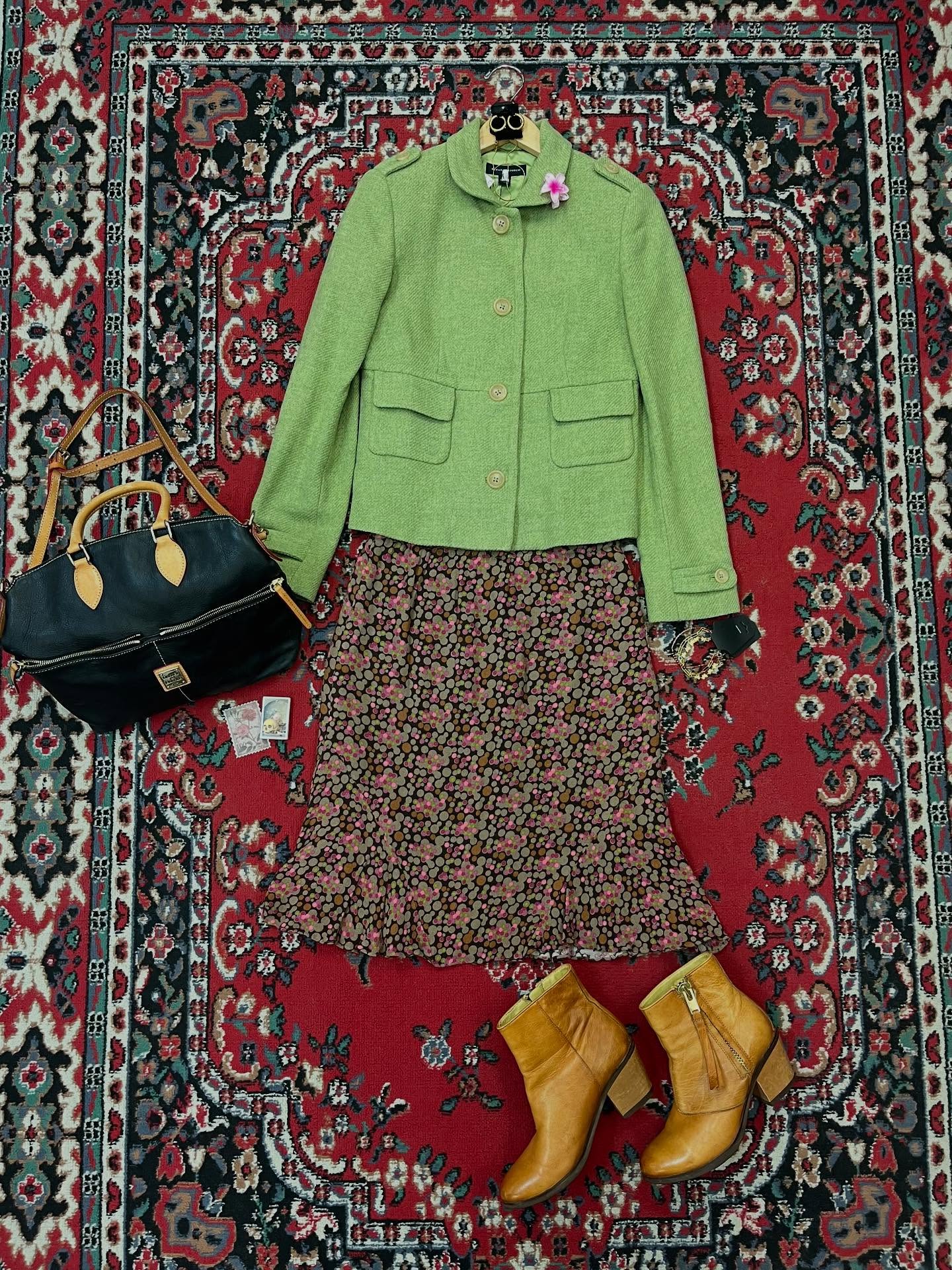 Springy layers that are still wintery enough to wear now will carry you through the seasons! This blazer would look great as a light coat over a tank top and jeans with Mary Jane flats on a warmer day! For now, what a cute look with this skirt! Outfit by Lee. #couchsaleswithldr #ldrstaffpicks
DETAILS:
Earrings- $23
Necklace- $16
Wool Blazer- Banana Republic, S, $21
Flower Clip- $4
Skirt- J Jill, 4P, $8.50
Bracelets- Red Beaded $11, Butterfly $18, Chain $19
Purse- Dooney & Bourke, $89
Boots- Bussola, 8.5, $55
Matches- $3
Sticker- $6