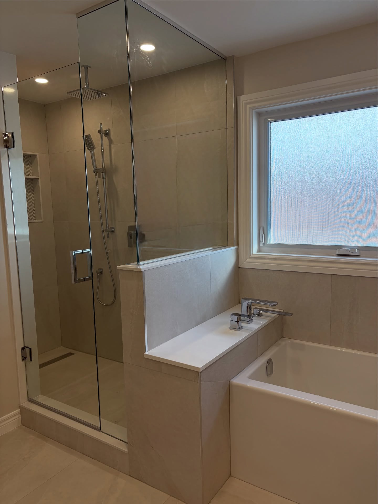 Timeless Luxury, Thoughtfully designed.
Clean lines, warm wood tones, and spa-inspired finishes come together in this stunning transformation.
Featuring a white oak double vanity with quartz countertop, sleek matte black hardware, and modern framed mirrors, this space blends style with everyday functionality.
The glass enclosed walk-in shower with a rainfall head and built in niche pairs perfectly with the elegant soaker tub - creating a bright, airy retreat designed for relaxation.
A fresh, timeless design built for comfort and luxury.
Contact us today for all your home renovation & interior design needs.
#homerenovation #homerenovations #bathroomremodel #bathroomdesign #primarybathroom