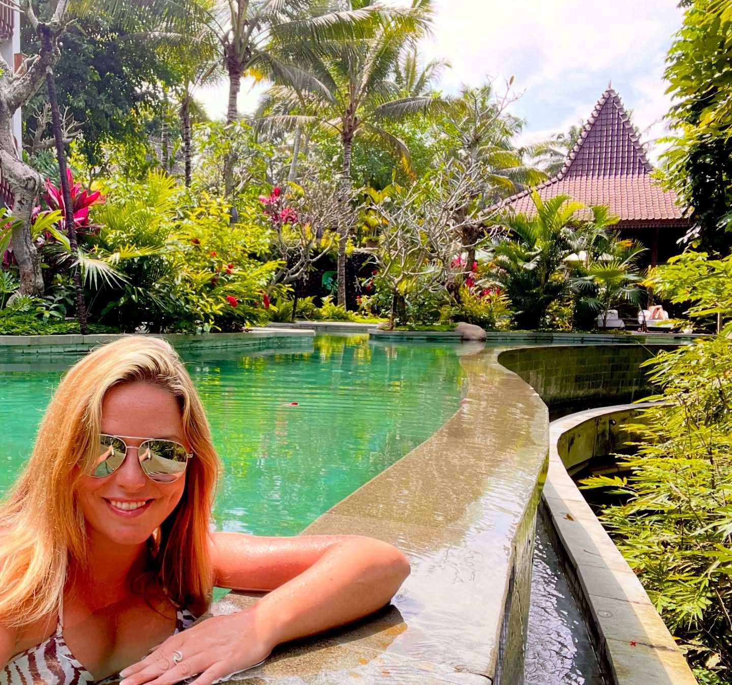 Come on in and have a nosey at our Bali hotel ladies! 🤩🌴🌺 THIS is where I’ve carefully chosen for us to stay for the first 2 nights of our Bali Adventure in the lush jungle just outside the hippy centre of Ubud and while we’re here you’ll be able to:
Soak up the gorgeous rainforest, gardens and pool views from your Balinese style room balconies…
Bathe like a queen in a flower filled bath…
Enjoy a floating tropical breakfast in the pool…
Hang out with Balinese women making temple offerings from exotic flowers…
Practice relaxing yoga on the rooftop above the treetops…
Be pampered in the tropical spa…
Sip cocktails in the rooftop bar as the sun sets over distant volcanoes…
And, generally just float about in this gorgeous pool… heaven! 🩵
And that’s only what we have lined up at the hotel before we even explore Ubud and the rest of our Bali Adventure 😁
Head to the Travel Queen website to check out our full itinerary of everything we’ll be getting up to on this amazing trip of a lifetime this summer, from 28 June to 9 July - there’s a link in our profile and stories 👉
#selfcare #solofemaletravel #sofetravel #bali #pov