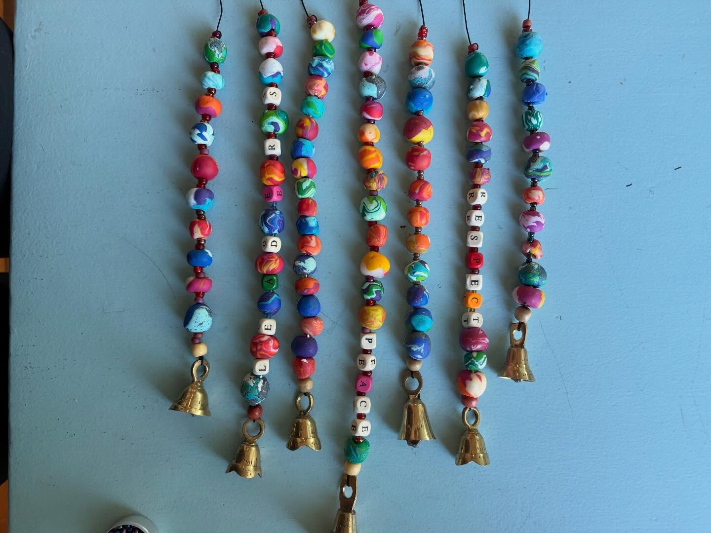 Leaders, peace, respect surrounded by homemade beads. Thank You 9-12 Seton Montessori