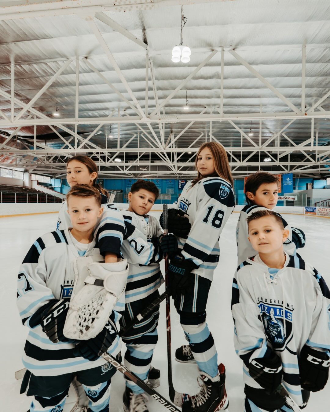 When your 6 kids play hockey, you take family photos at the rink!