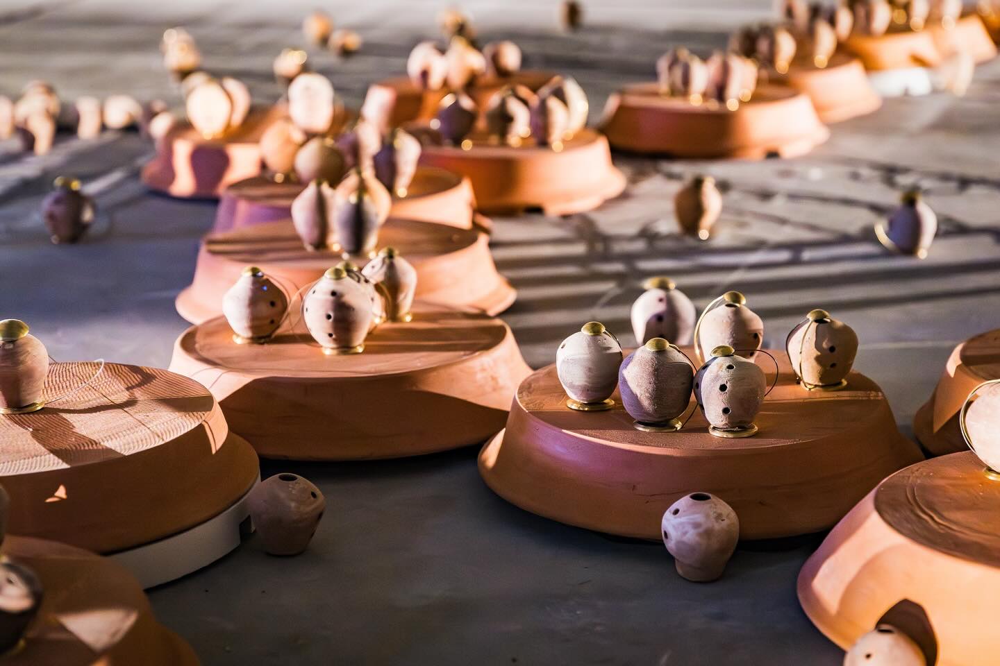 Microtonal
Faqir Zulfiqar, Allah Jurio, Invisible flock
Clay, custom electronics, audio synthesis
Microtonal is FREE and open all weekend as part of Rotherham Music’s Signals Festival 2026
Find the installation at Forge Island, Rotherham.
21 - 22 Feb, 10am - 4pm
23 - 27 Feb, 4 - 6pm
Free to experience, What3words: ///plan.cried.bike
Utilising bespoke technologies Microtonal is an audio reactive, algorithmically driven installation of 200 borindos (boreendo or bhorindo) - a clay wind instrument from the desert of Sindh, Pakistan and recently added to UNESCO’s Intangible Cultural Heritage in Need of Urgent Safeguarding list.
The installation has two listening states - responding to field recordings of Faqir Zulfiqar playing the borindo, and the second state where individual borindos respond to the ambient sound of the space and audiences in the exhibition.
Microtonal presents what is perhaps the largest archive of this unique instrument and explores their sound as a bridge between places and time, finding the tones of the object, moving from dissonance to familiarity, slipping between scales and around the edges of the music they hold in them. Microntal reimagines preservation not as static memory but as a dynamic, collaborative act of cultural resilience.
https://invisibleflock.com/projects/microtonal
#art #soundart #collaboration #rotherhammusic #invisibleflock