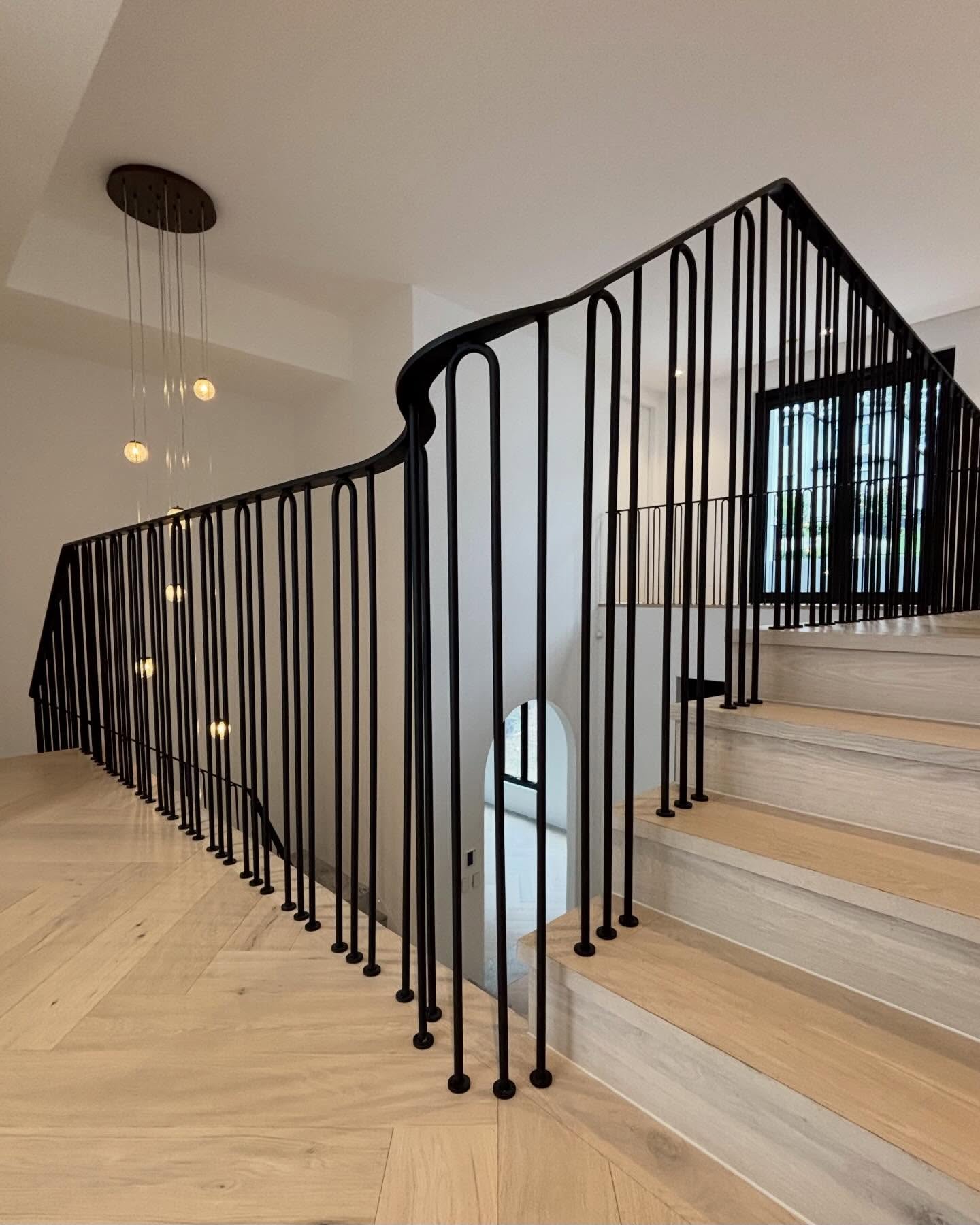 A project with bars installed individually into the ground
# Matt Black. Round Material. Flat Bar Grab-Rail.