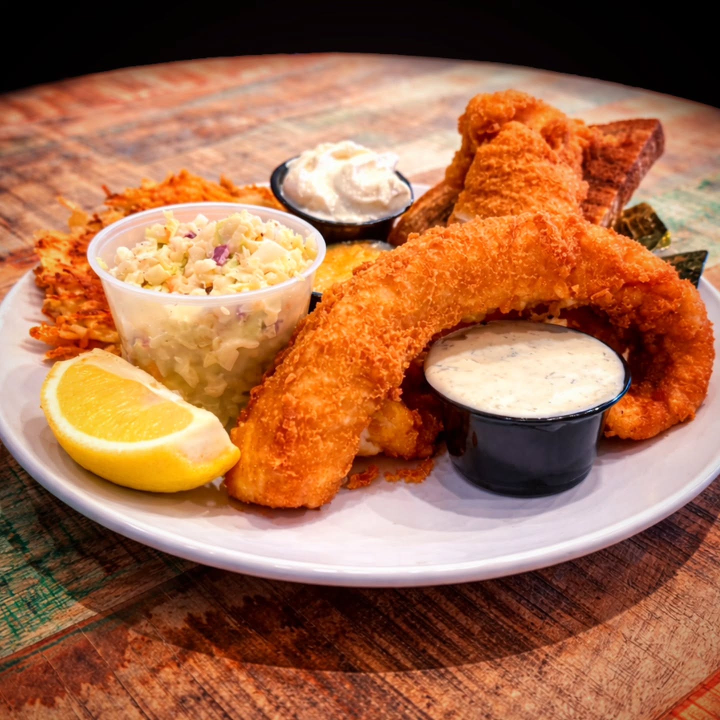 FISH FRY FRIDAY!!! Join us tomorrow! Dine-In Only!
Sconnie Style Walleye Fry
Light & Crispy Beer Battered Fresh Walleye, 2 Homemade Cheesy Potato Pancakes with Sour Cream and Apple Sauce, Zesty Coleslaw, House Tartar Sauce with your choice of Hawaiian Rolls or Thick Cut Marbled Rye, Butter and Lemon.