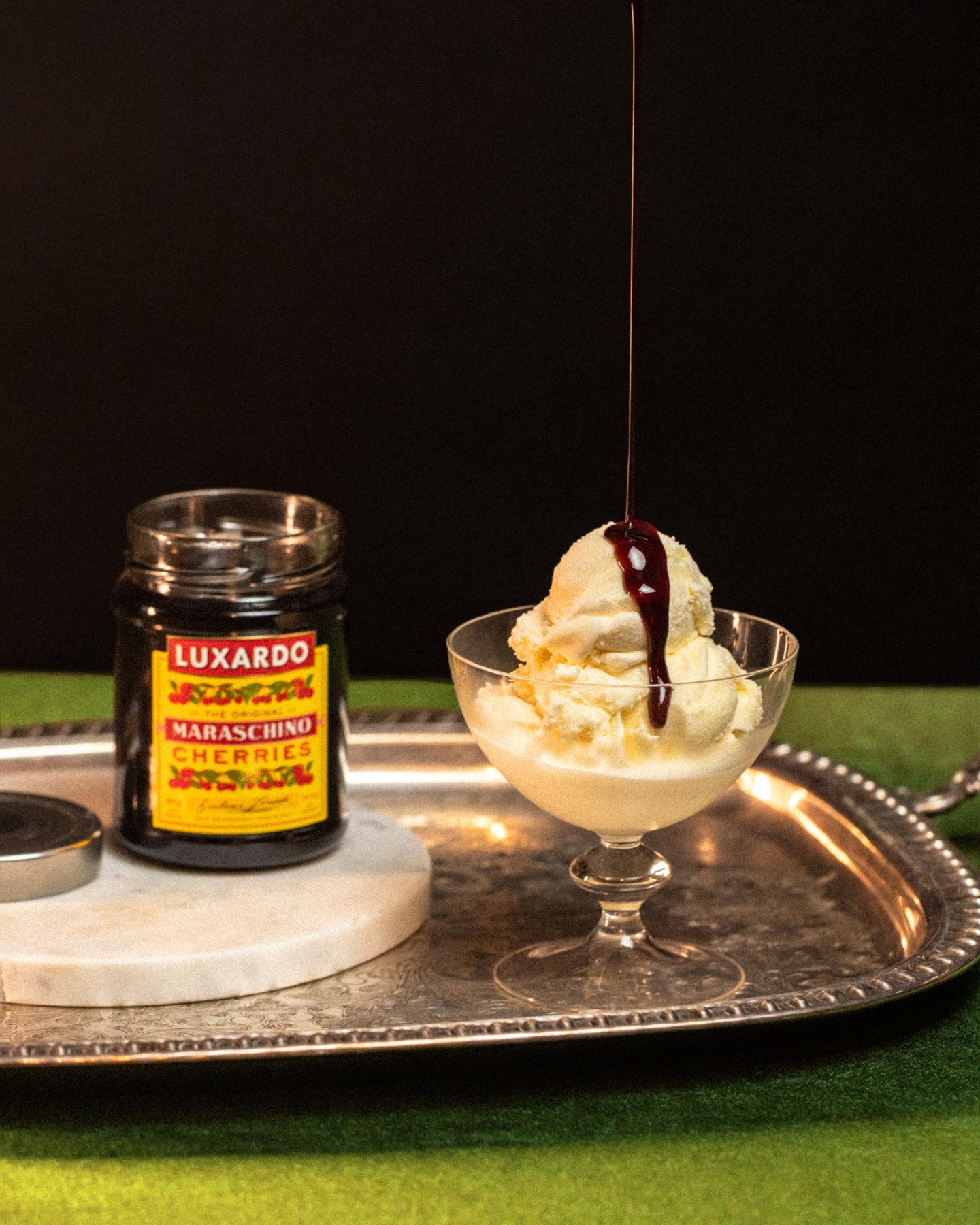 A little drizzle goes a long way. Vanilla ice cream topped with Luxardo cherry syrup and our signature Maraschino Cherries. ๐จ๐