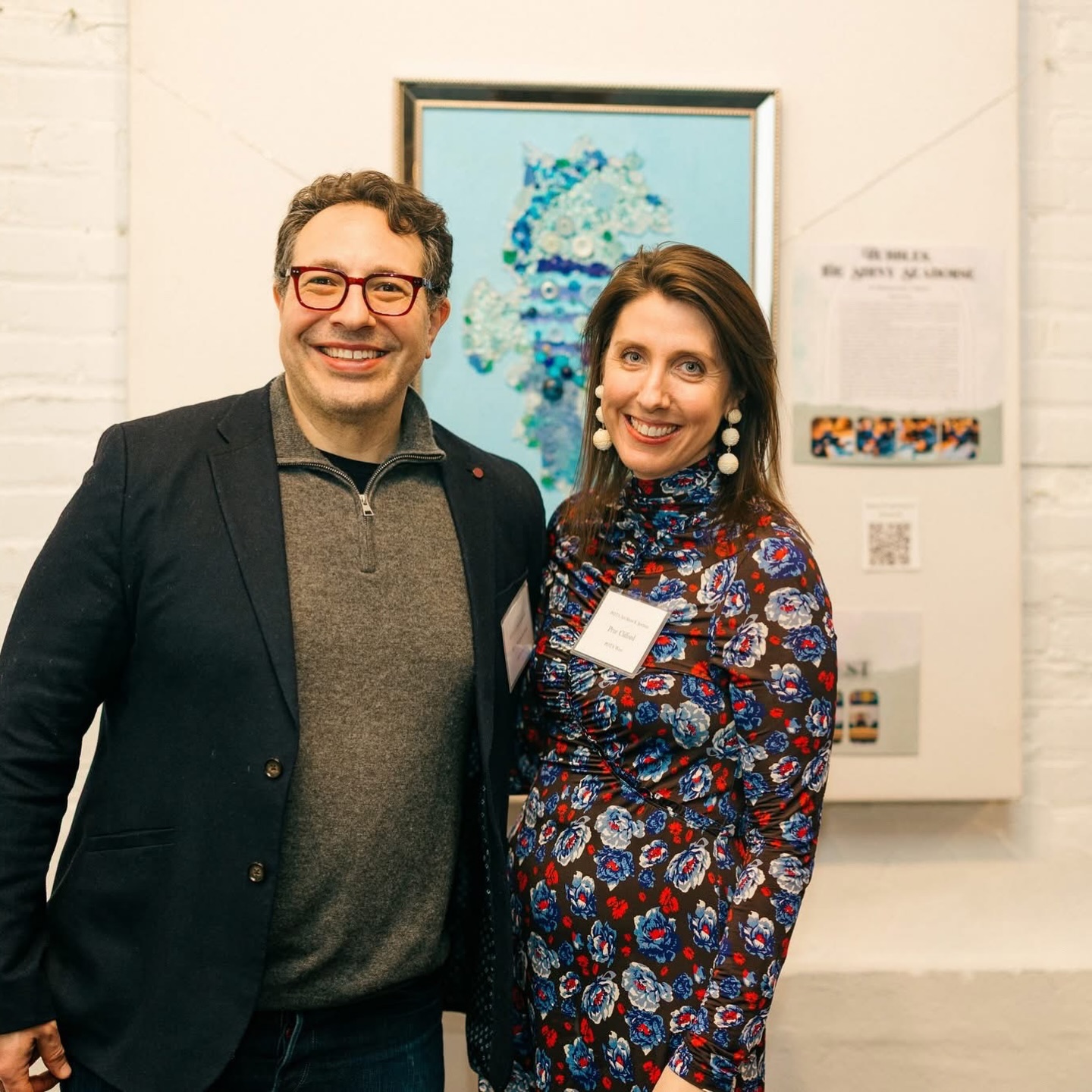 Congratulations to the Clifford-Sonnereich Family ❤️#POTAArtAuction
West Preschool 2: Bubbles, the Shiny Seahorse
For our art auction project, the children engaged in a thoughtful, multi-step process centered around the theme of taking care of our world. Tu B’Shvat reminds us of the beautiful and delicate nature of our planet and how we can care for it and, by extension, help animals and sea life, like a seahorse. All of the loose-part materials used in our artwork were pieces we collected around the school and the neighborhood.
We began by planning and exploring the shape of a seahorse together, using printed seahorse outlines as a guide. Each student filled in their seahorse using blue colored pencils, markers, and Kwik Sticks, experimenting with different shades, pressure, and textures. Next, we transitioned to a collaborative experience by creating a large group seahorse cut out of cardboard. The students mimicked the same process they used on their paper seahorses, this time adding blue loose parts and securing them with glue, reinforcing both fine motor skills and material awareness. After that, we introduced smaller cardboard seahorses, allowing the children to embellish them with glitter and other sparkly materials, encouraging creativity and attention to detail.
Once the children were familiar with the form, materials, and process, we were ready to begin our final piece. We painted the canvas blue using a pouring technique and rollers, creating a dynamic, ocean-like background. When the paint dried, we outlined the seahorse using sea glass. The children then worked carefully, filling in the remaining spaces one section at a time with a variety of materials, including beads, sequins, paper pieces, buttons, gems, and stones. Through this layered and intentional process, the seahorse slowly came together, and once every space was thoughtfully filled, the artwork was complete.