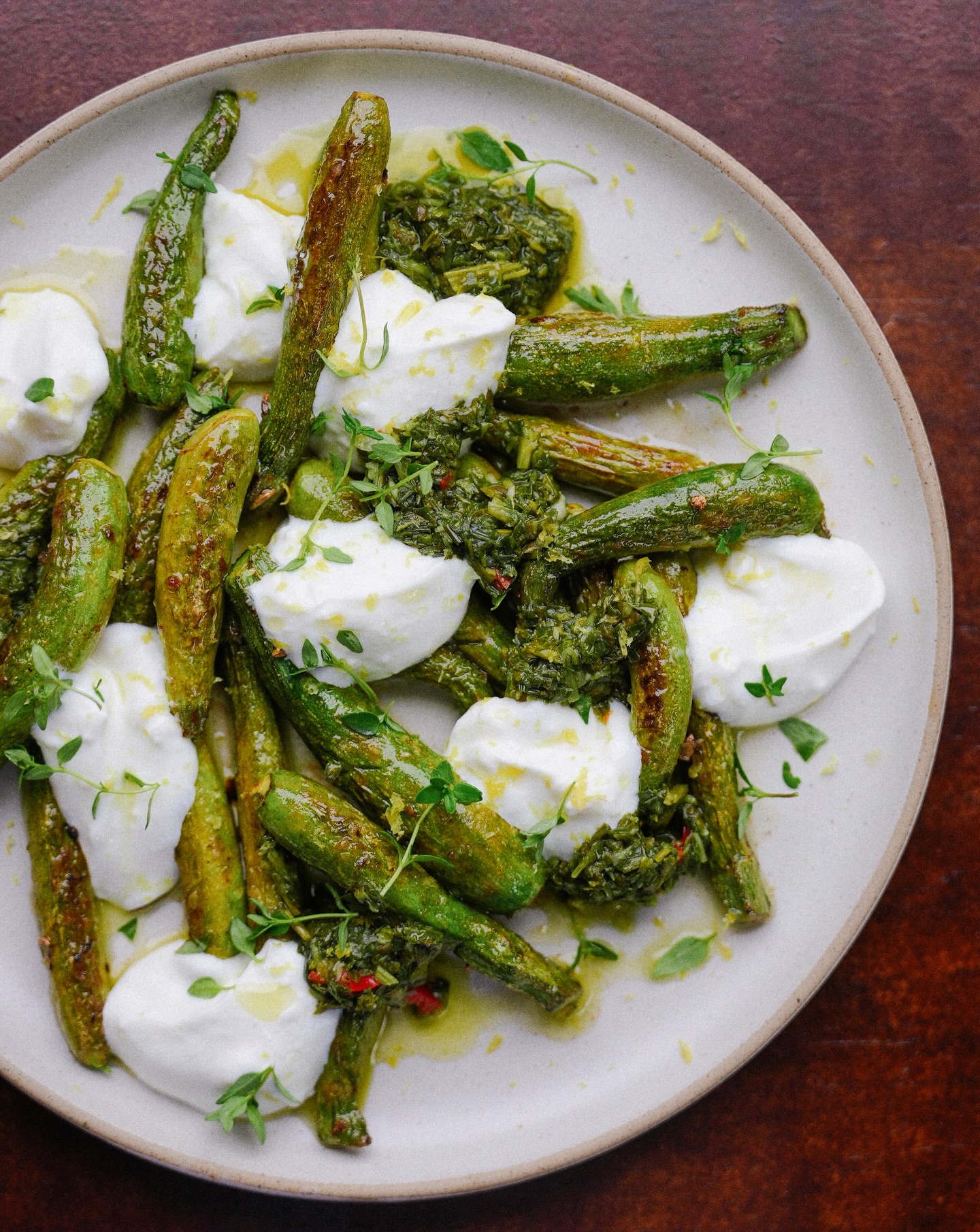 Cute lil zucchinis sautéed in olive oil, salt and lemon. Dollops of whipped feta and a bright herby sauce. Topped with toasted fennel seeds, fresh thyme and more lemon zest.