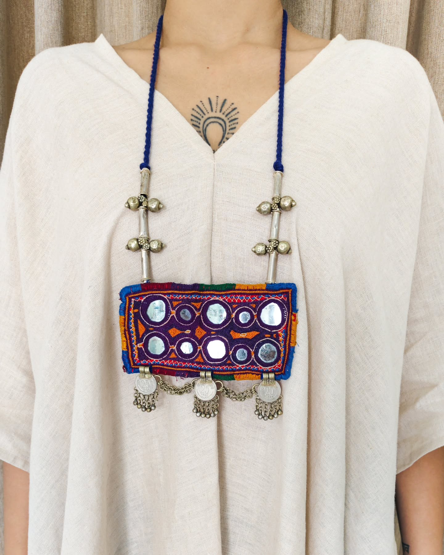 A rare fragment of vintage Banjara embroidery,
preserved in its raw integrity.
Timeworn coins and storied threads, carrying the quiet artistry of time.
A one of a kind addition to your jewelry collection ✨
.
.
.
.
.
.
.
.
.
#MadeInIndia #YayawarIndia
.
.
Lambani Embroidery, Banjara Jewelry, Lambani Jewelry, Indian Textiles, Slow Fashion, Heritage Fashion