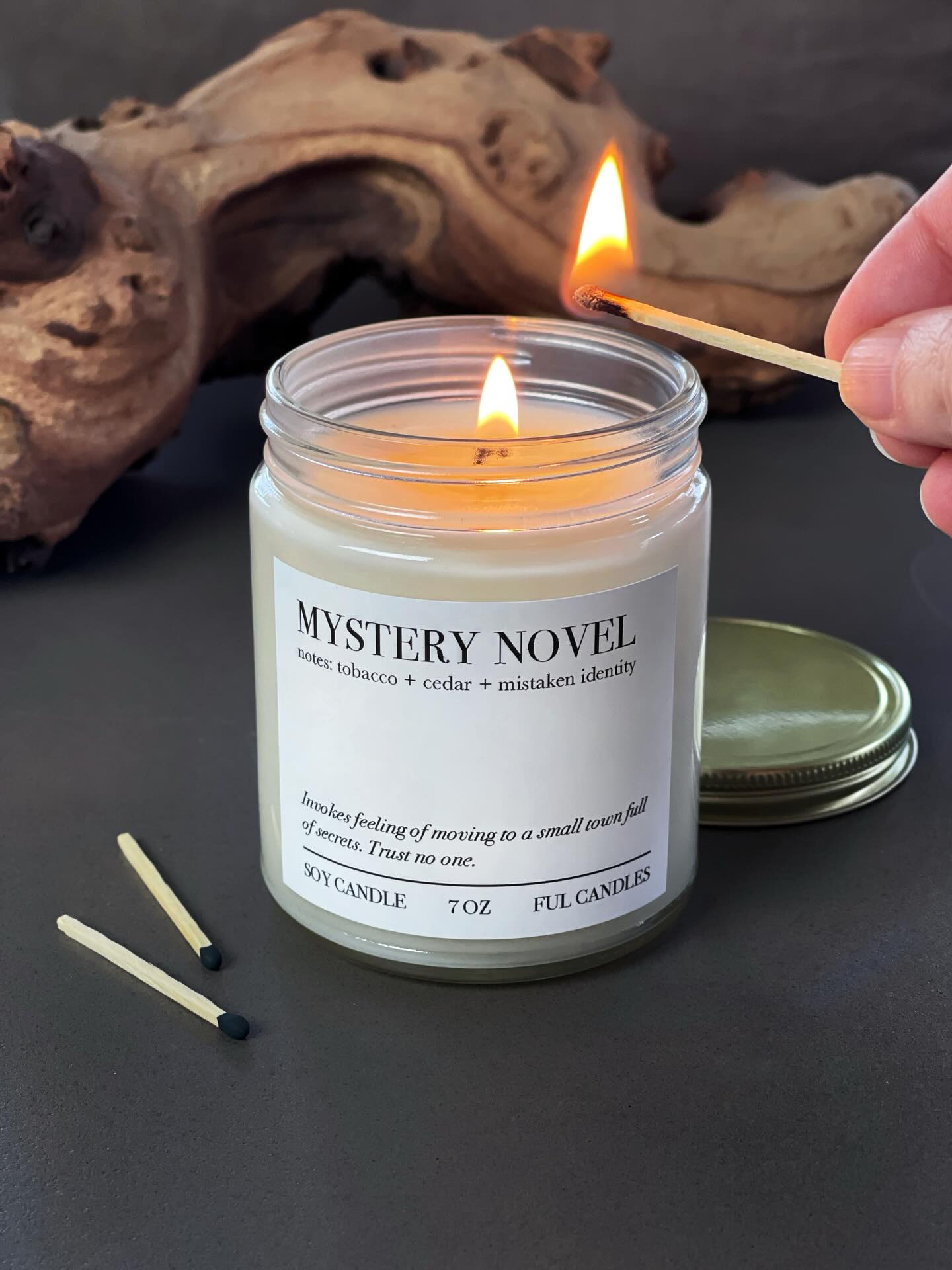 Our mystery novel candle: Wisps of tobacco smoke, freshly cut cedar, rich sandalwood, hints of amber, and several notes you can’t put your finger on. An atmospheric mystery. It’s soft, yet complex. It’s foggy mornings in the countryside cradling a warm mug of London fog tea, but it’s also footprints in a mossy gorge that may or may not lead to nefarious activities. Keep your eyes (and nose) open so nothing is missed. 🔎