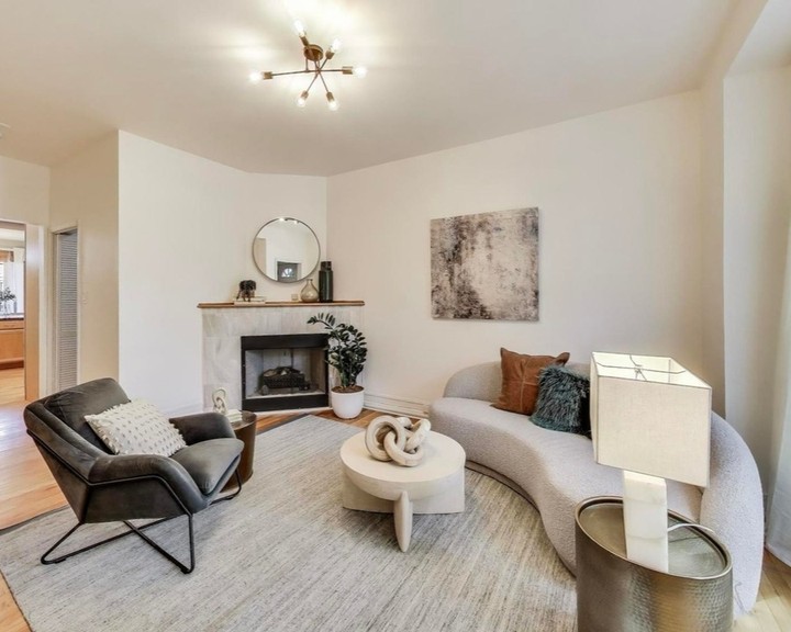 Staging makes this asymmetrical space feel open, functional, and cozy! Round silhouettes help soften the angled walls, while a reading setup makes an unusual niche space functional. #chicago #chicagorealestate #havenhomestager #chicagohomestaging #stagingworks #stagingsells #staging #homestaging