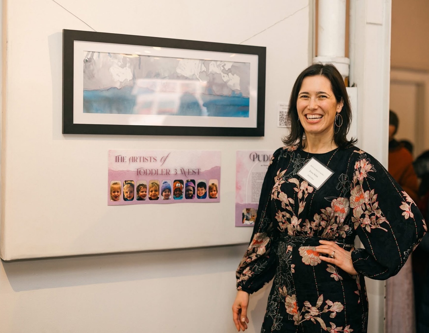 Congratulations to the Sirkin-Chopra Family #POTAArtAuction
West T3: Puddles
Before beginning this artwork, each friend in the Toddler 3 West class was invited to explore and experiment with the simple, everyday materials we would be using. The children worked with watercolor paint and water, swishing their fingers gently from side to side and observing how the colors changed as the water touched the paper.
Since this piece was inspired by spring, we spent time talking about puddles and noticing how the colors moved and spread through the “puddles” on our paper. The process was just as meaningful as the finished artwork, allowing the toddlers time to explore, observe, and create in ways that felt authentic to them.
As we worked on this piece, we also created different areas throughout the classroom where the children could continue experimenting with how water moves and how watercolor can change the appearance of various materials. We practiced the special side-to-side swishing motion used during painting and focused on using just one finger as our paintbrush. This supported the development of focus and fine motor control, while also honoring nature by using minimal and simple materials.