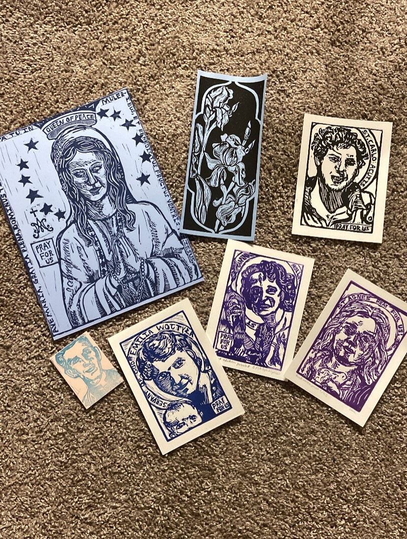 It is wild how nice art looks in frames! (Swipe through for the before and after)
These are the pieces I’m submitting for an upcoming art jury for an art show I’m hoping to participate in this fall. Next on the to do list is figure out/put together a portfolio for it too.
For anyone looking to add to their Saint Icon or Marian Collection, additional prints of these linocut prints are available on my Etsy or DM for purchase (frames not included).
The Our Lady Queen of Peace Linocut Print is only available via DM at this time, there’s a few different color way varieties of different ink and background color combos that I have already printed or I can print a specific color request. $35/print for the Our Lady Queen of Peace print, and prints are roughly a little under 9”x12”
Saint Agnes linocut print also only available via DM, it was a Patreon mail club exclusive print for this past January but I still have prints left that for anyone who can’t wait until the end of the year print club catch up listings, you can purchase them now instead for $20/print ($22.50 if you want the sticker and mini print from the January mail club too!)
These prints are all handmade, the only things that are not handmade that I sell are my items listed on Redbubble and the stickers/postcards included in the PenPal tier of my mail club on Patreon :)
#linocutprint #peopleofprint #catholic #art #foryoupage