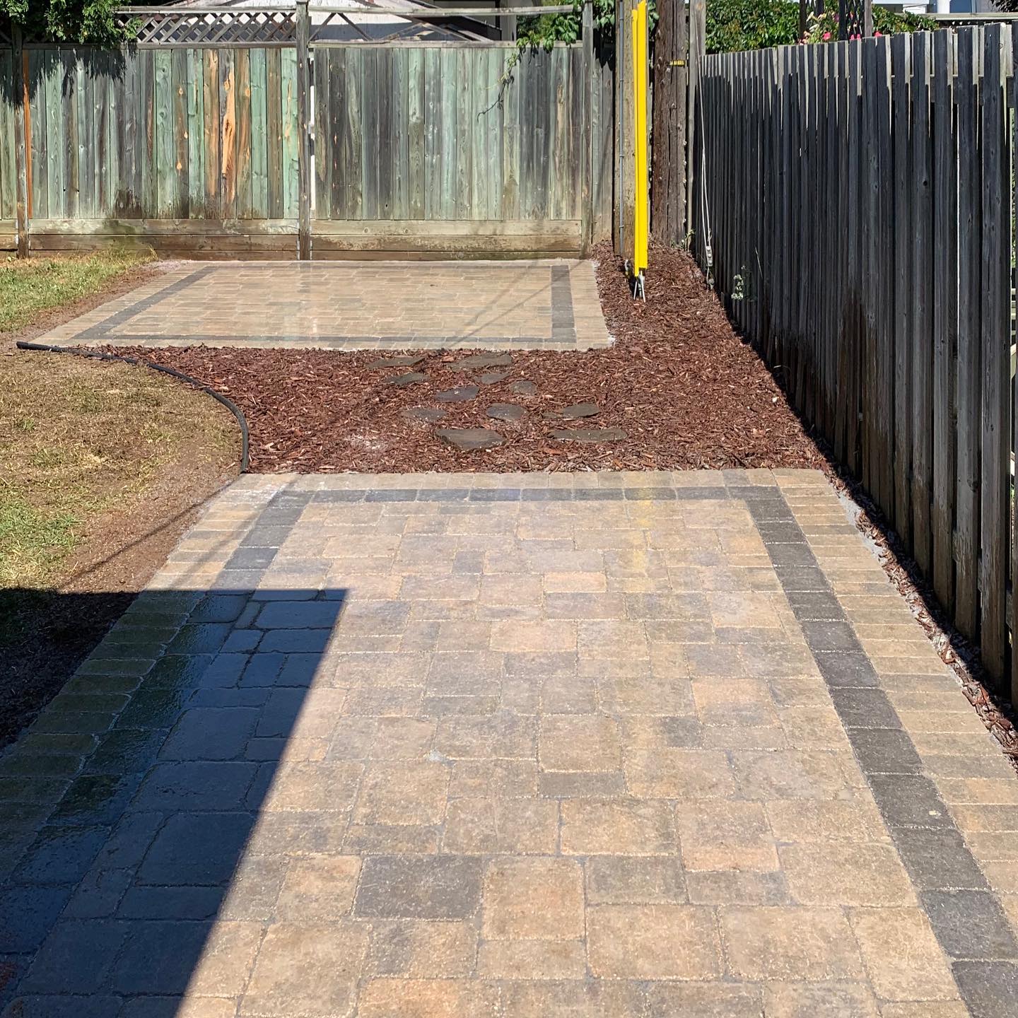 This backyard just got fixed up with a couple nice Roman paver patios. All ready for a seating area, gazebo, fireplace etc, lots of options! #twodayjob#barkmanconcrete#insetboarder#lessgrasstocut#readyforrelaxing#curbappealmatters