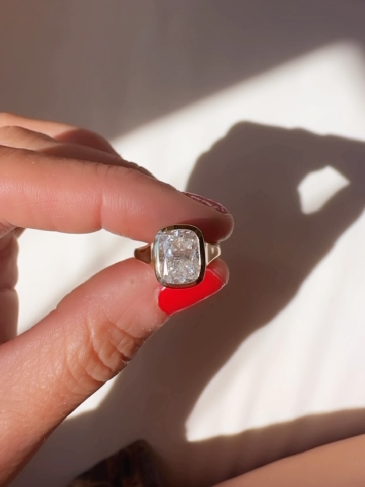 There’s many ways to do anything - and this is especially true in love and art. ❤️ So many ways to riff with one another and express your style, your view, your love and the path you have chosen with another human. ❤️ This was a very special engagement ring as her partner truly valued her hand and touch in the creation of the ring. Regularly I hold wedding band carving classes at the studio where the sculpting of a wedding band or simple ring in wax results in a golden wedding band made by the person or partner that will wear it everyday. I had never done a piece where I helped someone to form their own engagement ring. But together we did it.:) After sourcing an absolute stunner of a diamond, on a hot summer afternoon she worked the wax into a setting that would carry this diamond for her girl forever ❤️
Another ring come to life as a symbol of their love’s journey. ✨ This cushion cut diamond sunk in a gold bezel setting making it a classic and simple but stunning sparkler forever for these two beauties.❤️❤️