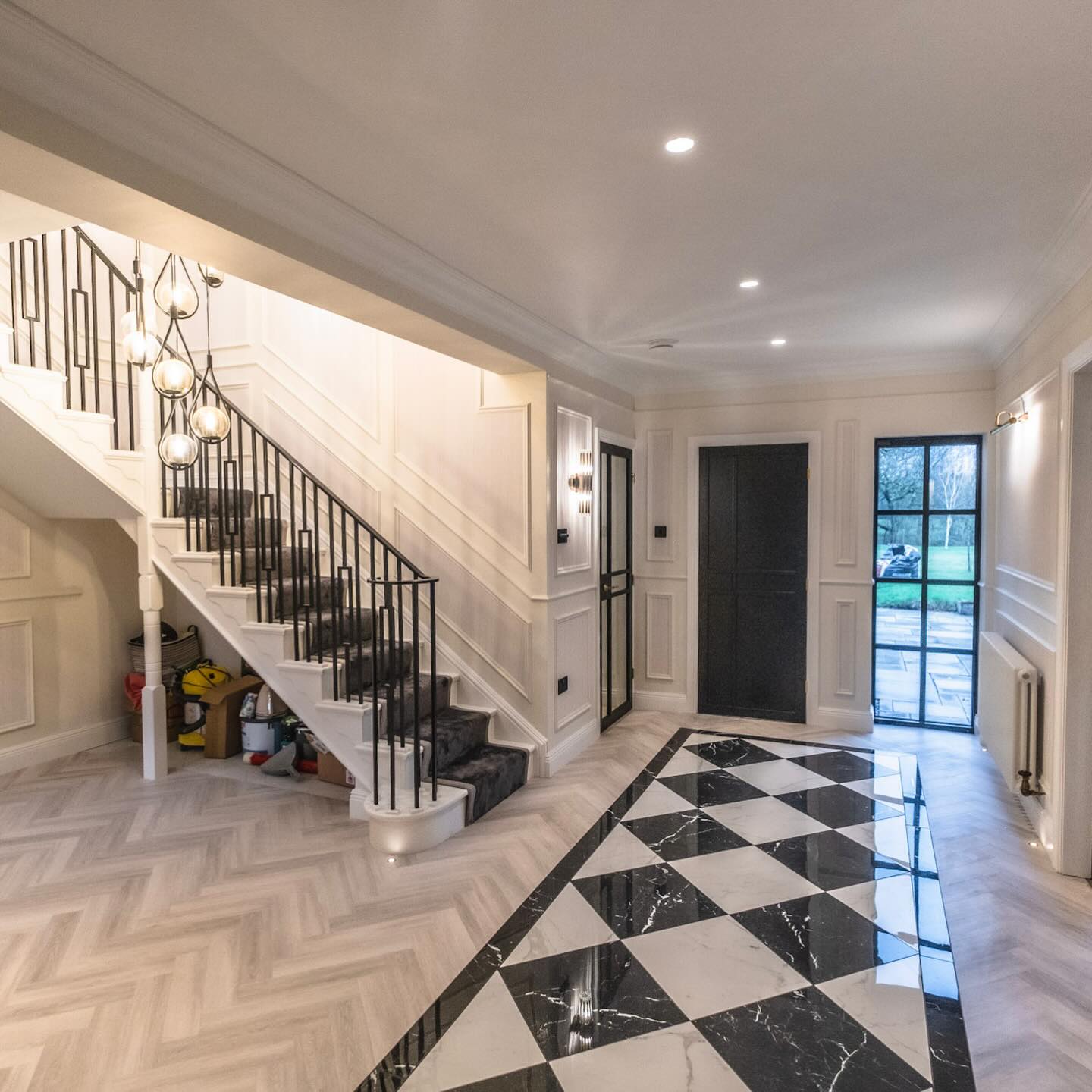 A statement entrance at Tithe House. ๐ฅ
The contrast between the stunning herringbone flooring and the bold black & white marble feature creates a real sense of arrival the moment you step through the door. Paired with the black crittall-style glazing and detailed panelling, itโs a finish that feels both timeless and contemporary.
Attention to detail underfoot makes all the difference.
Discover more forever homes via: www.peckmillprojects.com.
#PeckMillProjects #TitheHouse #CheshireHomes #LuxuryInteriors #Construction