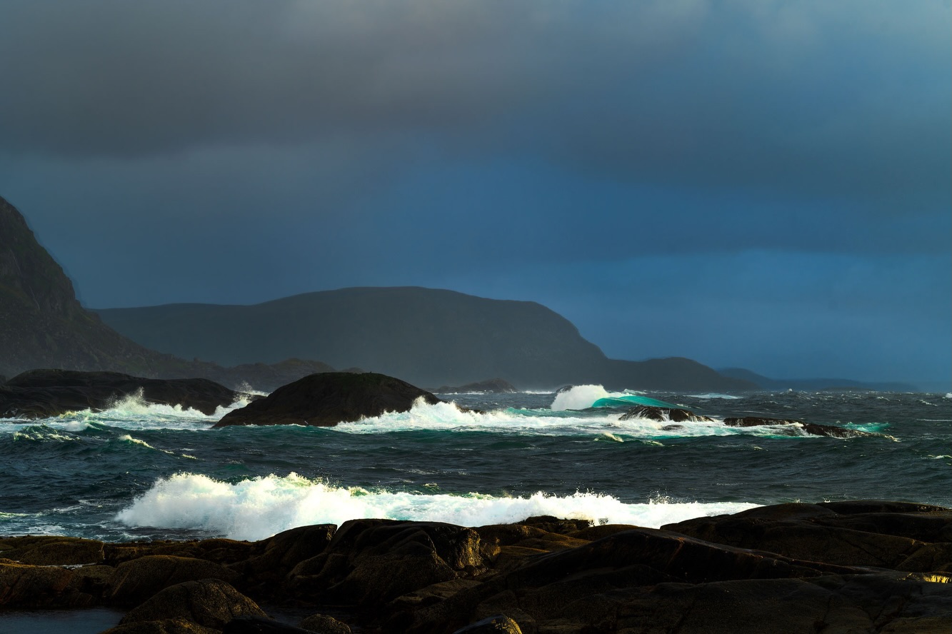 Lofoten is not always calm.
Some days the sea turns restless, heavy and unpredictable. Waves crash against the dark granite, spray carried sideways by the wind. The turquoise tones feel almost unreal against the steel-grey sky.
You don’t photograph this kind of weather comfortably. You stand firm, wait between gusts, wipe the lens, and try again.
But it is in these moments that Lofoten reveals its raw character: untamed, powerful, and beautifully indifferent.
#sigma70200