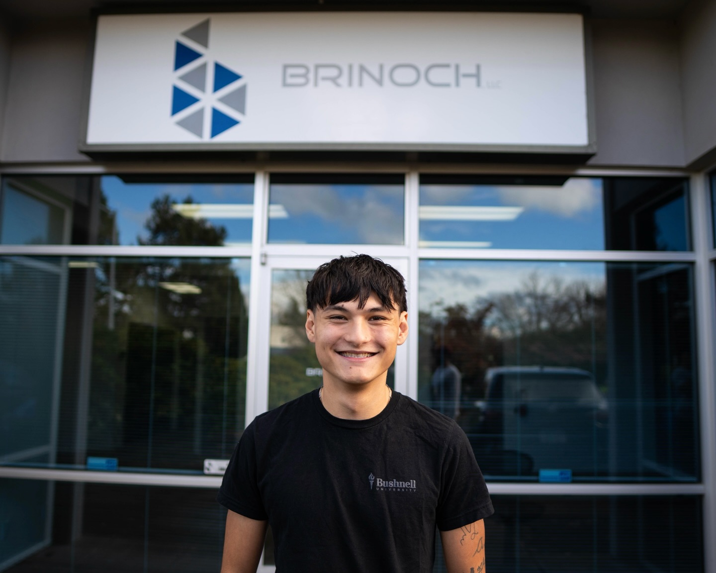 Nathan Griffiths gained hands-on technical experience through his fall internship with Brinoch, a company specializing in audio, video, and lighting system integration.
As a senior contemporary music industry major with an interest in live sound production, Nathan explored the setup and installation of PA (professional audio) systems by building equipment racks, soldering connections, and assisting with installation projects on job sites. His experience with Brinoch strengthened key technical skills while also teaching him the importance of preparation before installation.
For Nathan, his time with Brinoch emphasized the importance of seizing opportunities to step beyond campus and engage directly with professionals in the field. “I think it’s really great to get out of the Bushnell dome and go out into local businesses and actually start doing what you want to do in a field that’s related to what you want to do,” Nathan reflected. “It’s just good to get out and connect with people in the industry that you’re wanting to be a part of.”
Great work, Nathan! 👏
Watch the video on the Bushnell University YouTube!
Read the full article on the Bushnell website!