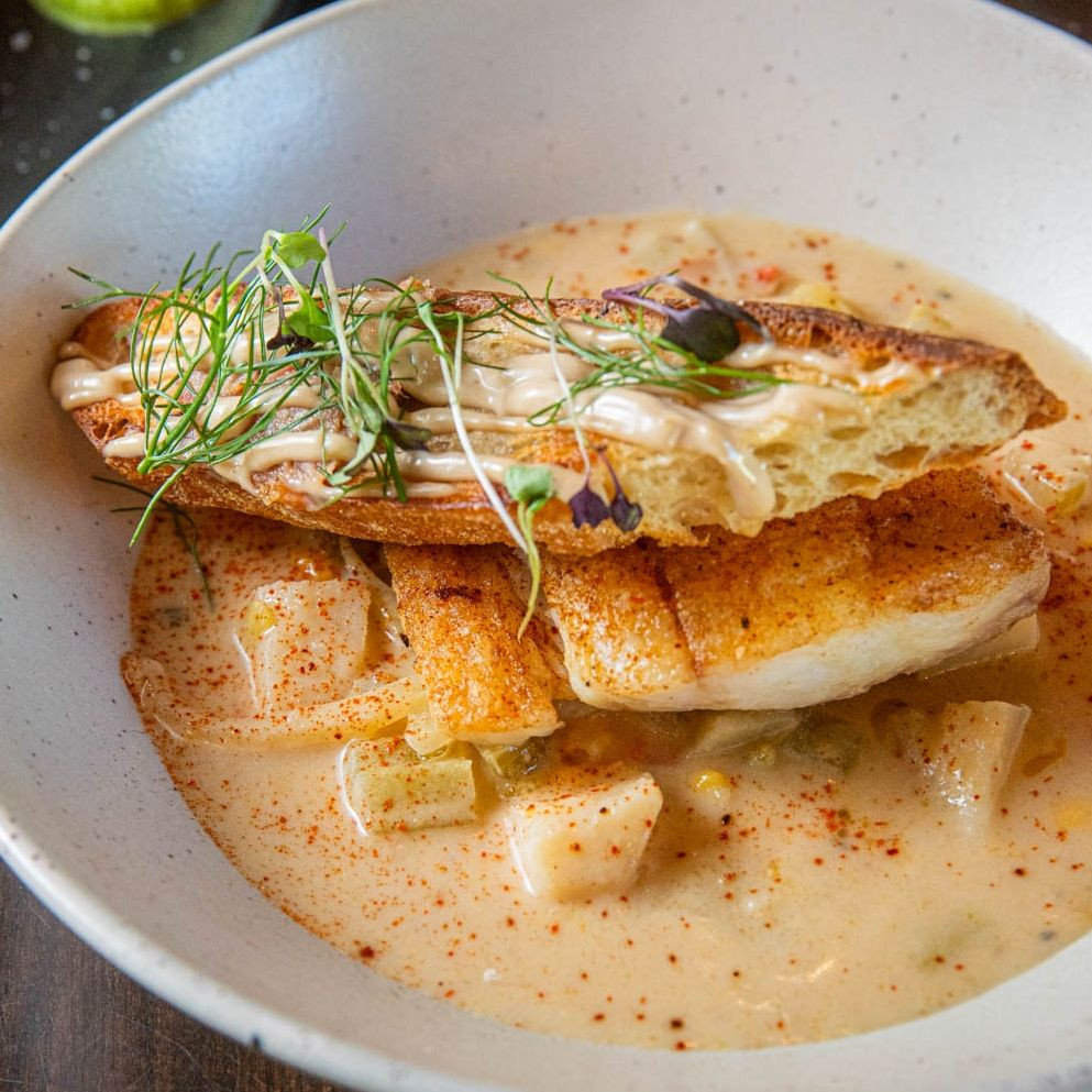 A spoon through velvety chowder.
A fork through golden halibut.
A bite of crisp bacon jam crostini.
That’s the Halibut Bourride experience. ✨️