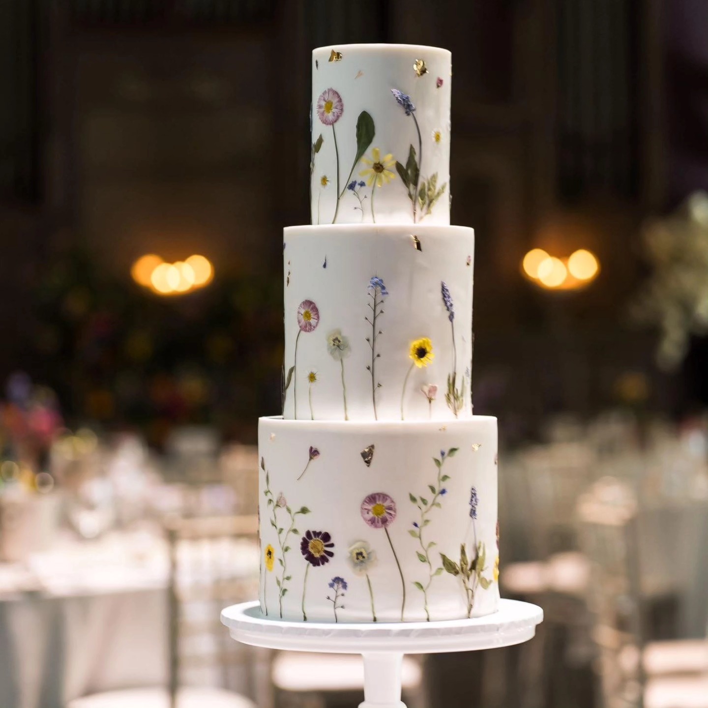 💮 Wildflower Elegance 💮
This beautiful three tier cake, dressed in delicate pressed wildflowers, feels like it's been lifted from a dream. Against the deep dark backdrop, every detail glows - soft, timeless and utterly romantic.
An absolute masterpiece by @zaracakery
Framed to perfection by @clairetennantphoto
#pressedflowers
#edibleflowers
#wildflowercake
#weddingcakeinspo
#natureinspired
#elegantcakes
#cakestyling
#luxurycakes
#pressededibleflowercake